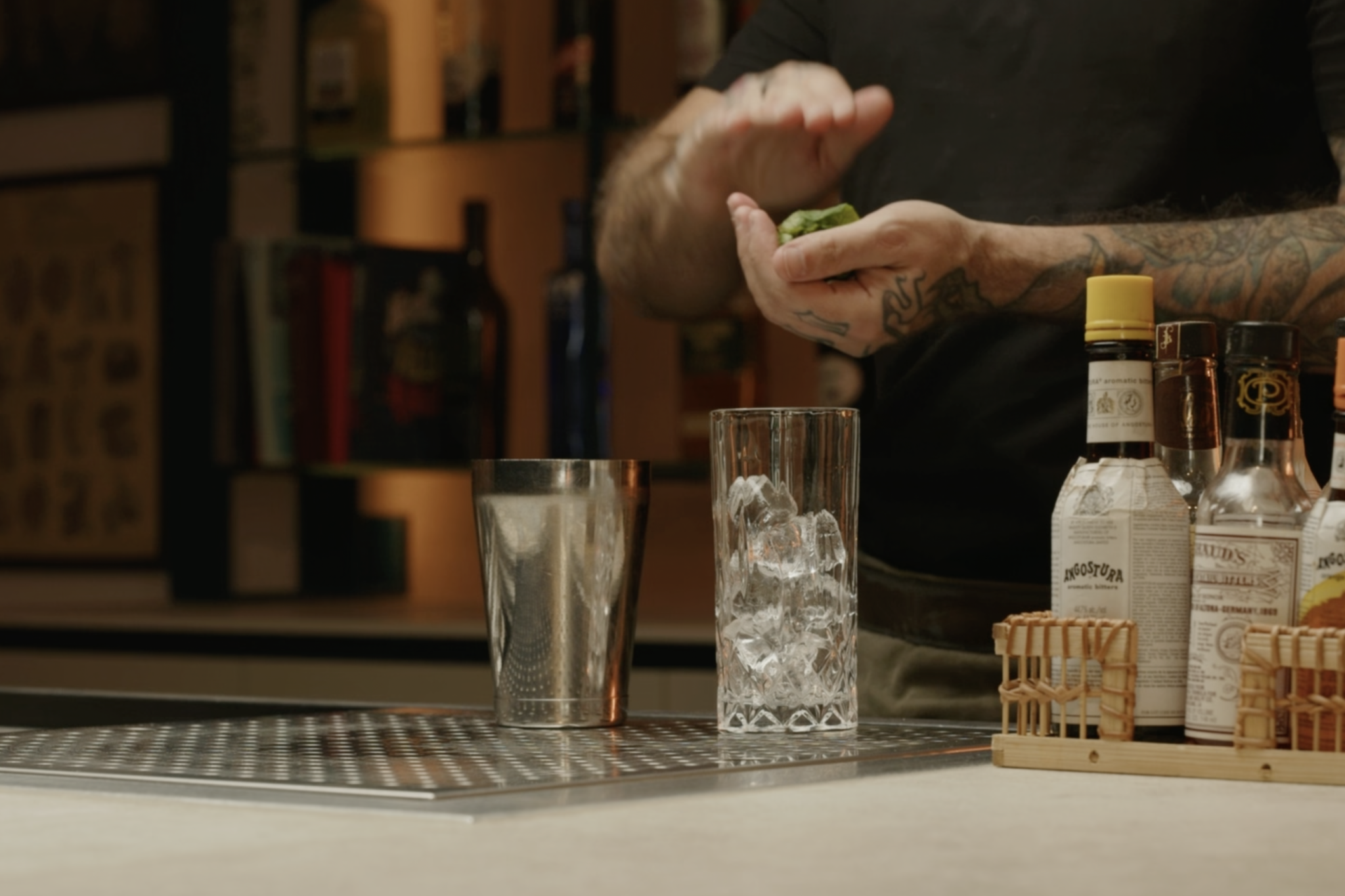 <p>Next, grab 8 to 12 fresh mint leaves, hold them in one hand, and gently smack them with the other hand to release their aroma—this helps bring out the bright, herbal notes of the mint, which will complement the absinthe. </p>