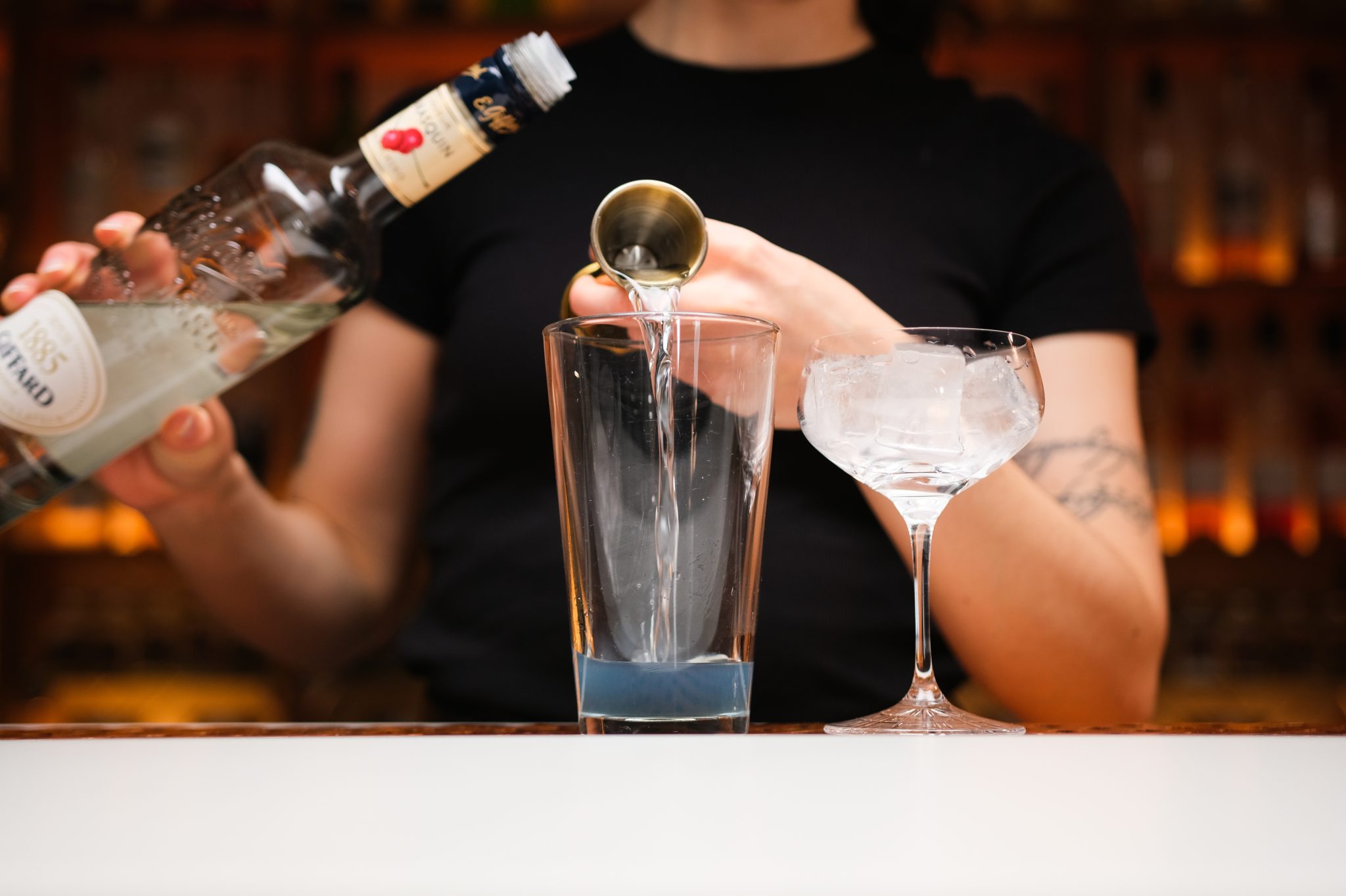 <p>Measure and add ½ oz of Maraschino Liqueur to the shaker. This liqueur will impart a sweet and slightly nutty cherry note to the cocktail.</p>
