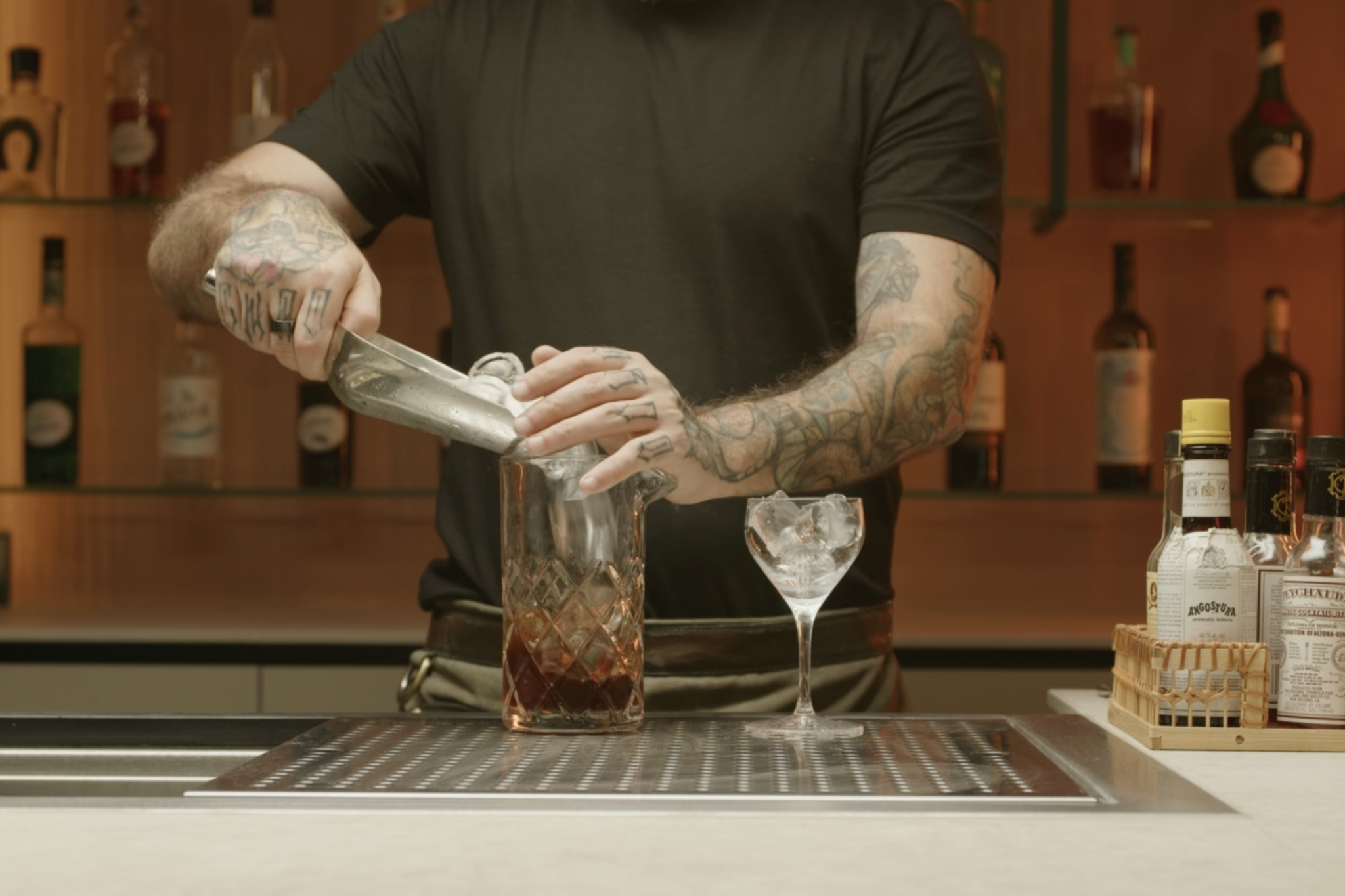 <p>Add ice to the mixing glass.</p>