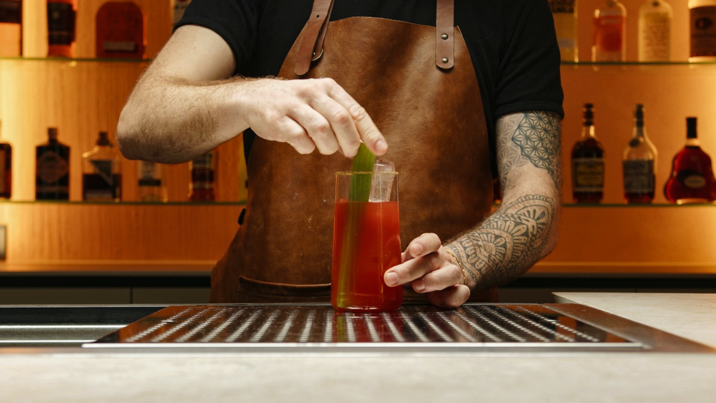 <p>Place a celery stalk and a lime wedge into the glass to enhance the visual appeal and offer additional flavor nuances.</p>
