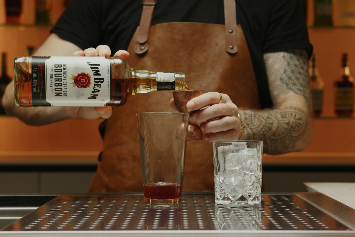 <p>Pour two ounces of bourbon into the shaker. The bourbon is the star of this drink, so choose a high-quality brand you enjoy.</p>
