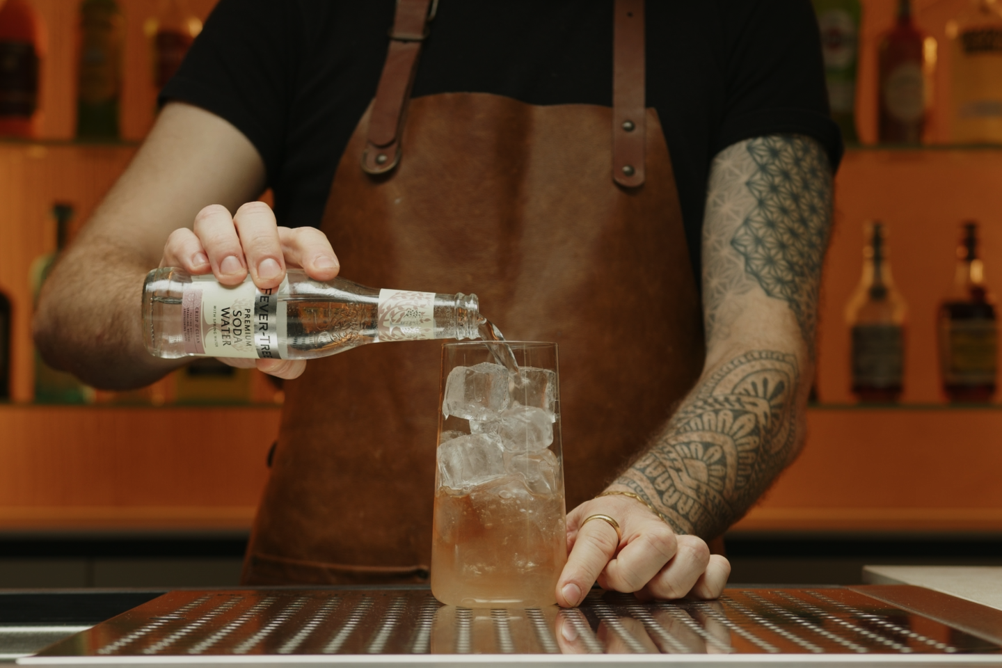 <p>Add some more ice cubes if necessary and top off the glass with club soda. This will give your Bourbon Rickey its characteristic fizz.</p>
