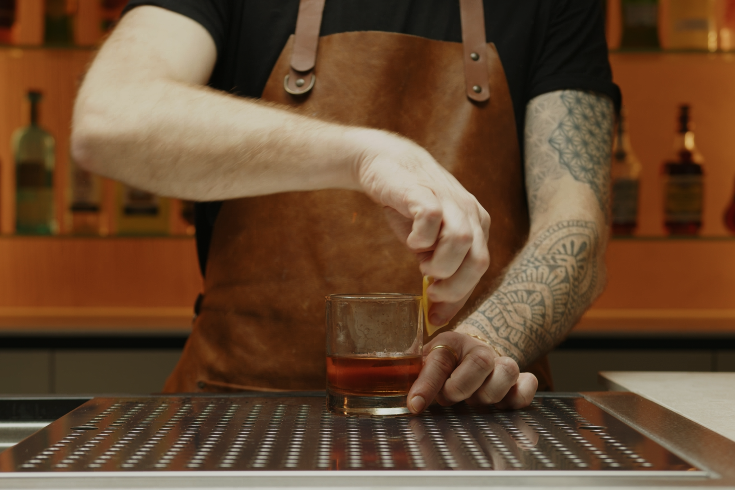 <p>Then, rub the peel around the rim of the glass before discarding it. This will add a bright citrus note to your Sazerac.</p>
