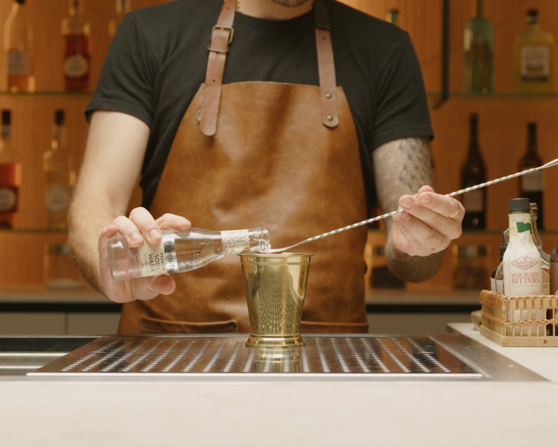 <p>Measure and pour a bar spoon of soda water on the sugar cube as well. It will help to dissolve the sugar further and add a slight effervescence to the drink.</p>
