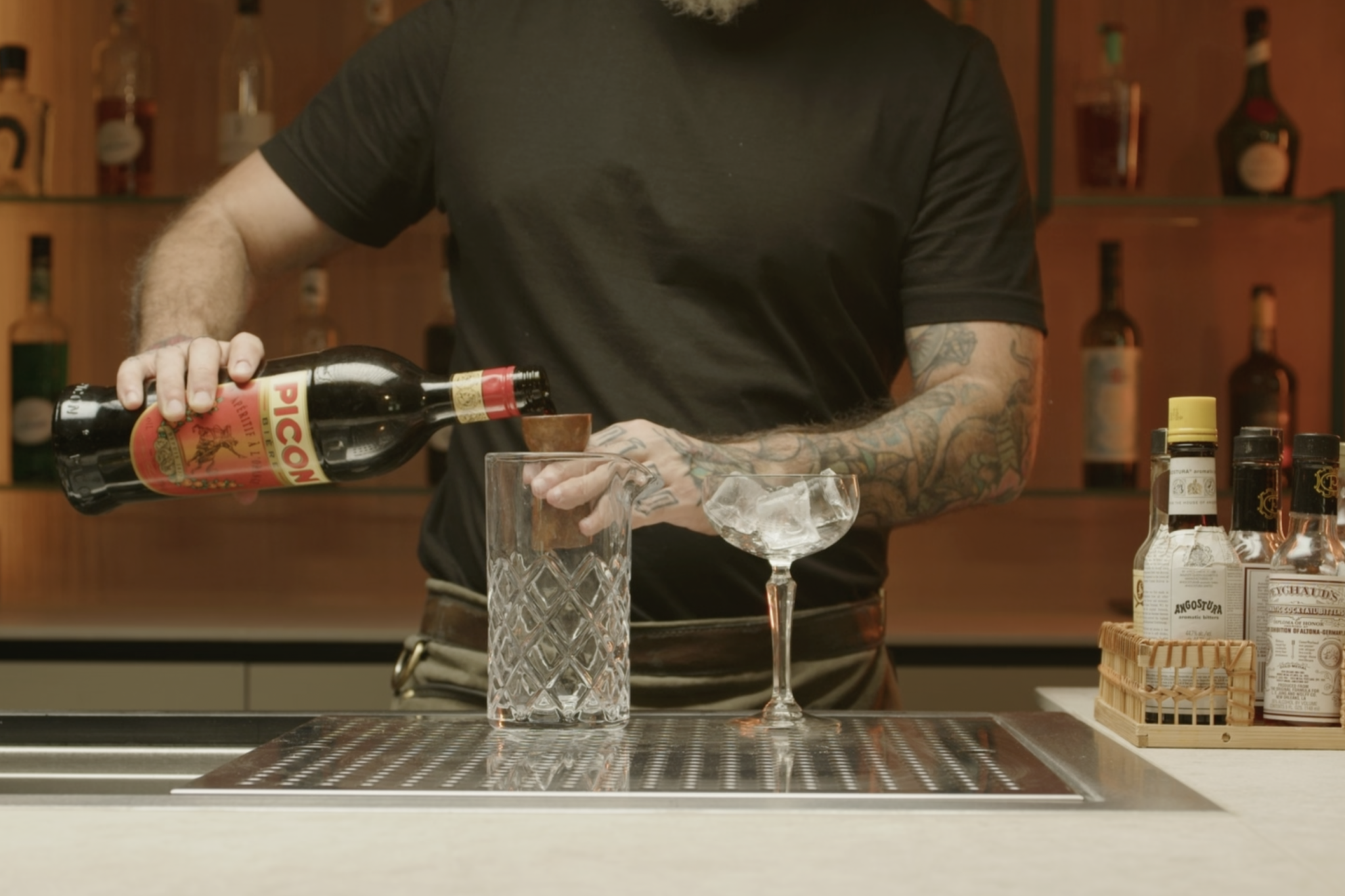 <p>In a mixing glass, pour ¼ oz of Amer Picon or Amaro Lucano</p>