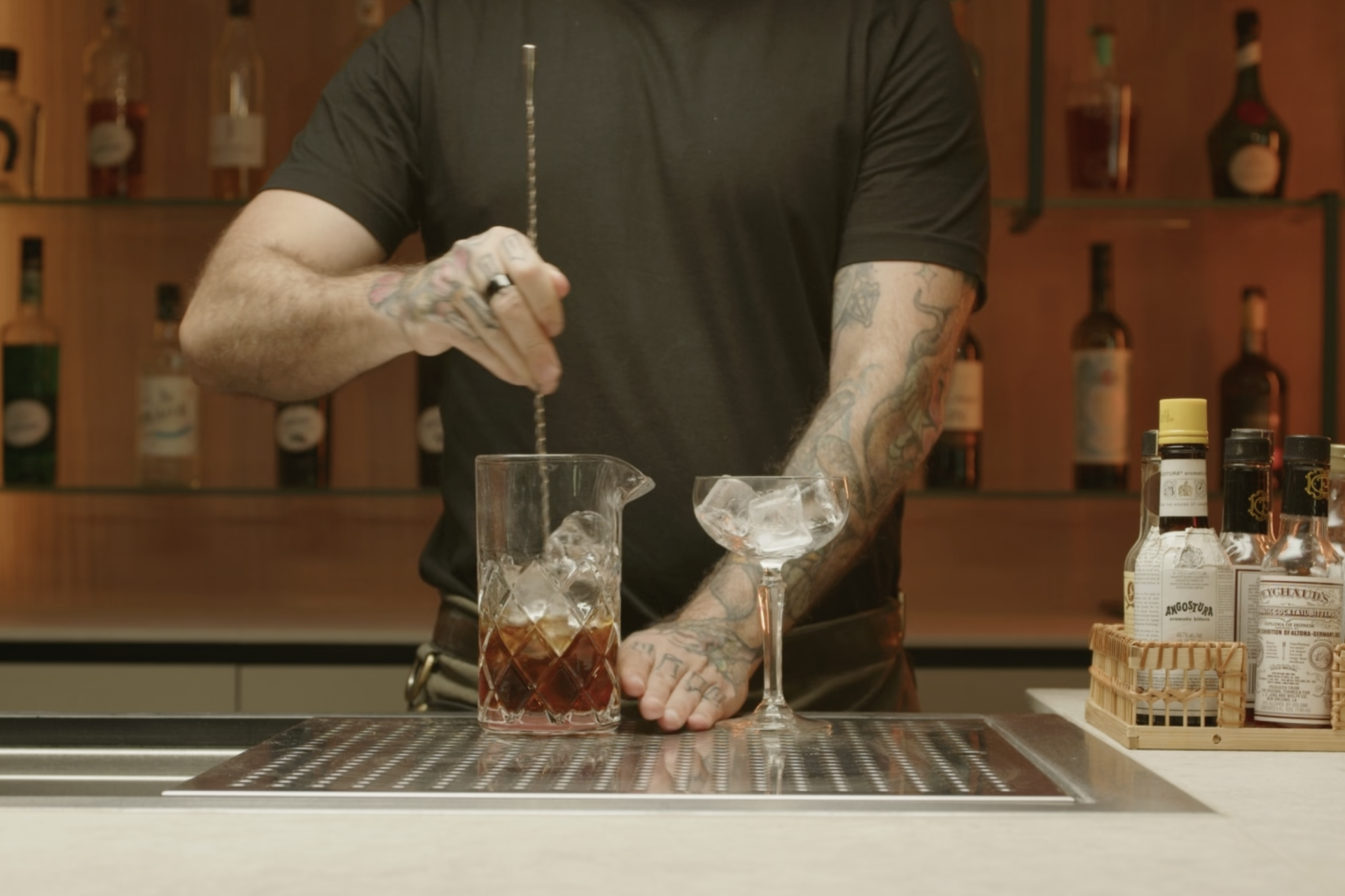 <p>Use a bar spoon to stir the mixture gently for about 20 seconds.</p>