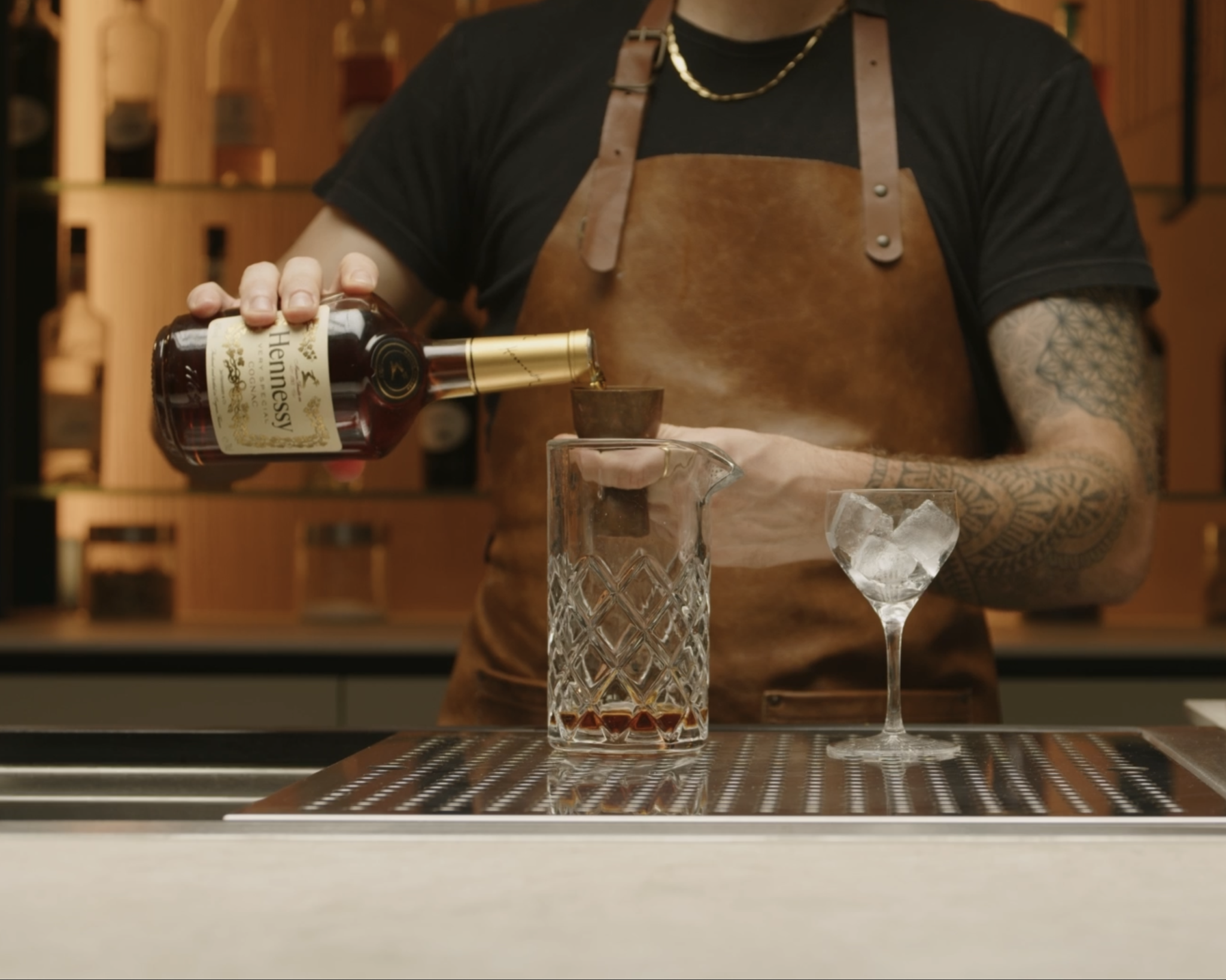 <p>Pour two parts of Cognac into the mixing glass. The Cognac serves as the base of the Corpse Reviver No.1, providing a rich and robust flavor.</p>