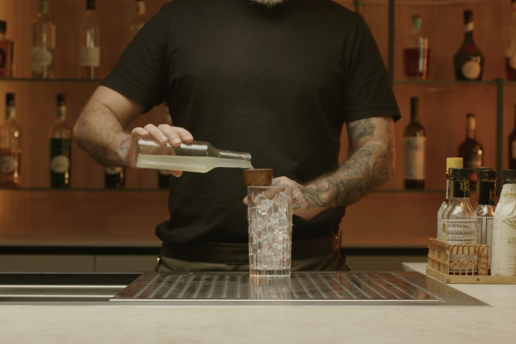 <p>Measure and add 2 oz of sweet and sour mix to balance the drink with sweetness and acidity.</p>