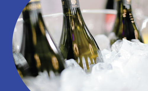 Three bottles in a bucket with ice