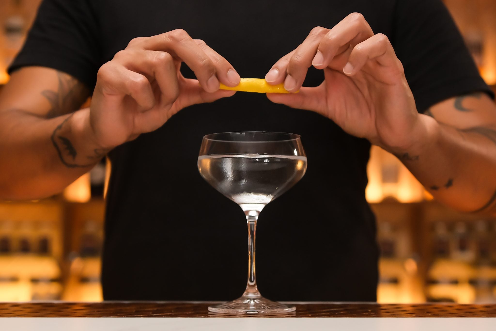 Lemon peel twisted over martini glass