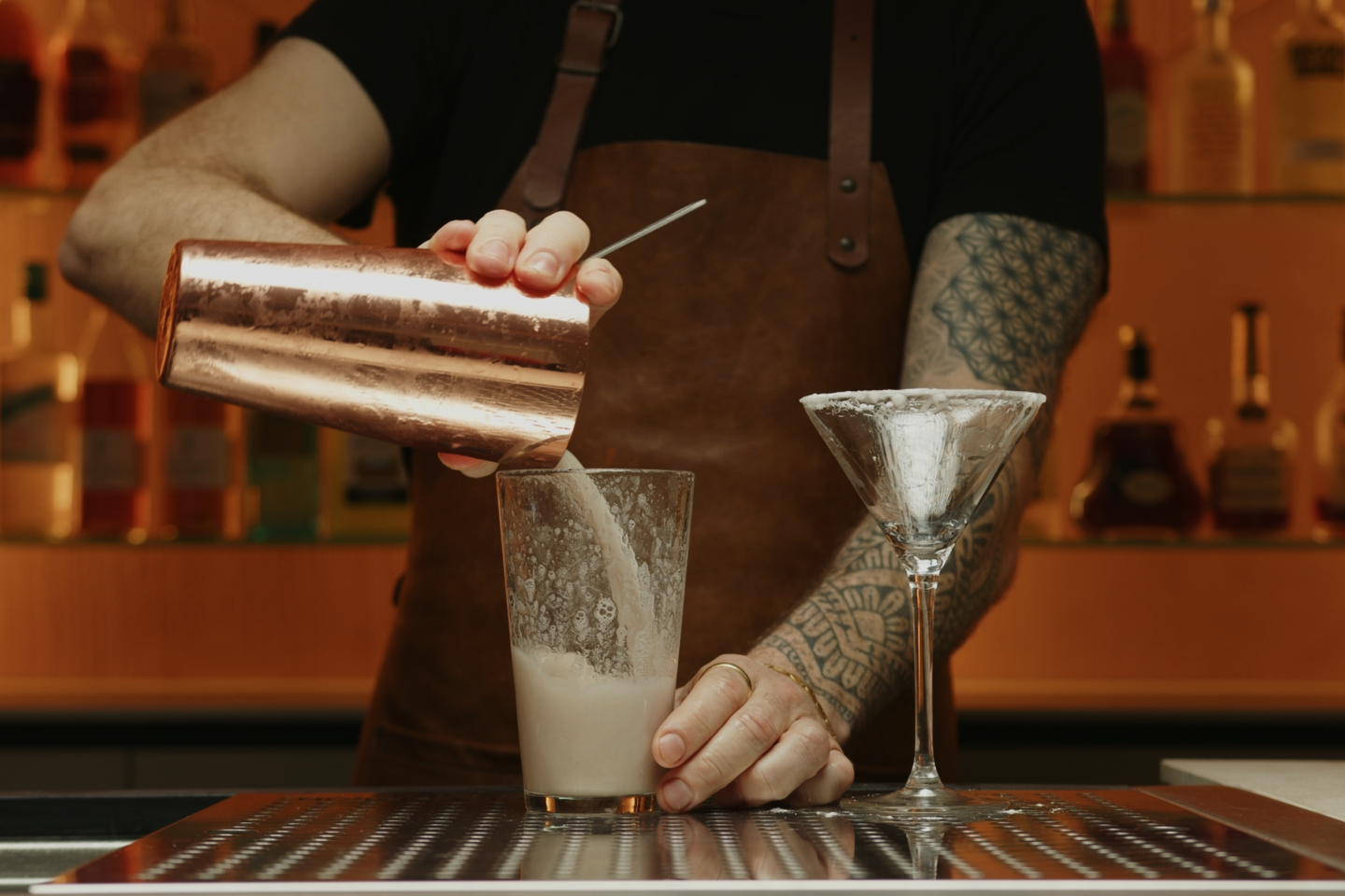 <p>Once you’re done, open the shaker. Using the cocktail strainer, pour the liquid in the other tin and discard the ice.</p>
