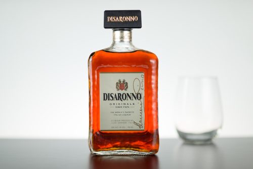 A side shot of a 750 mililiters bottle of Disaronno in front of a white background