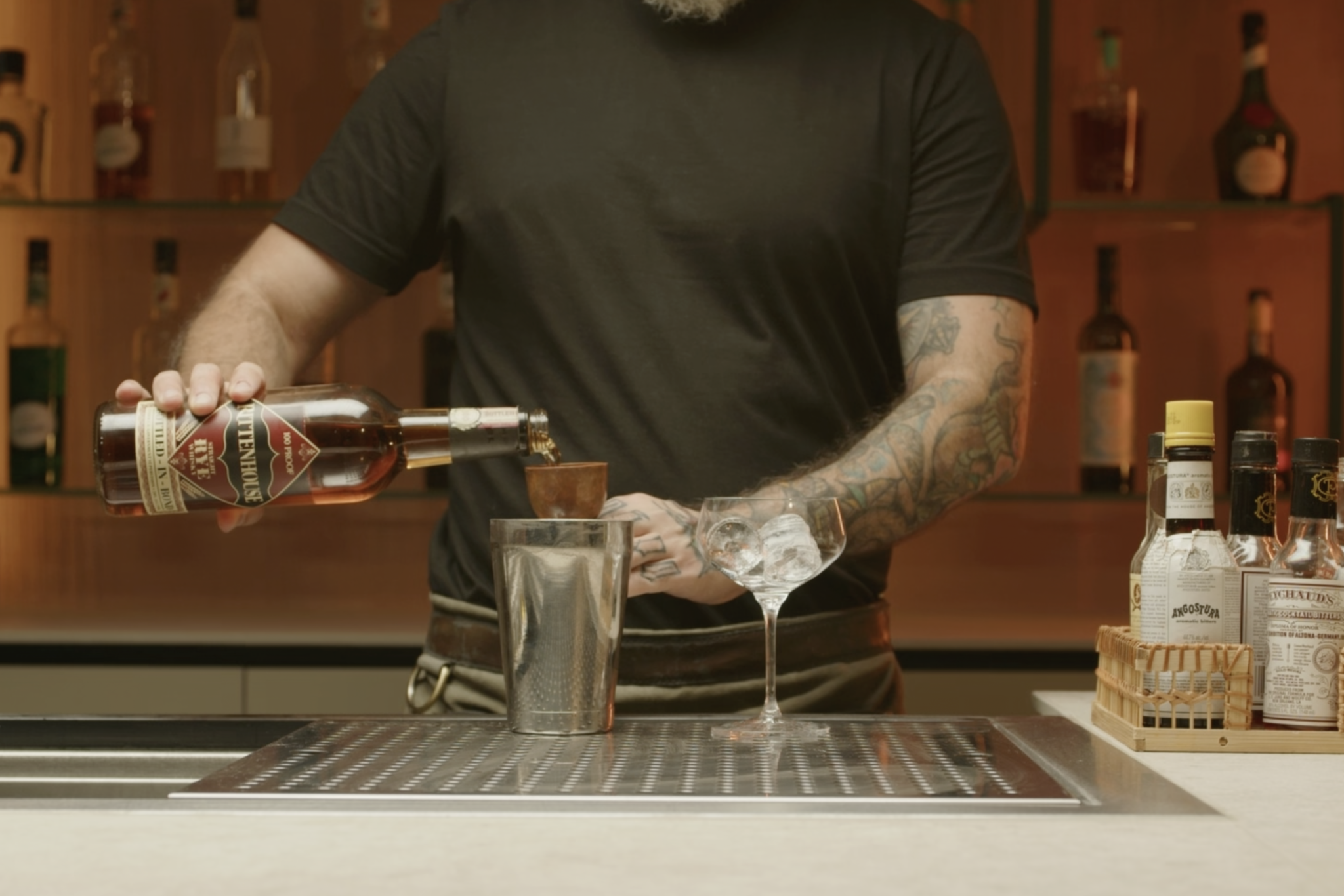 <p>Pour 2 oz of rye whiskey into the shaker.</p>