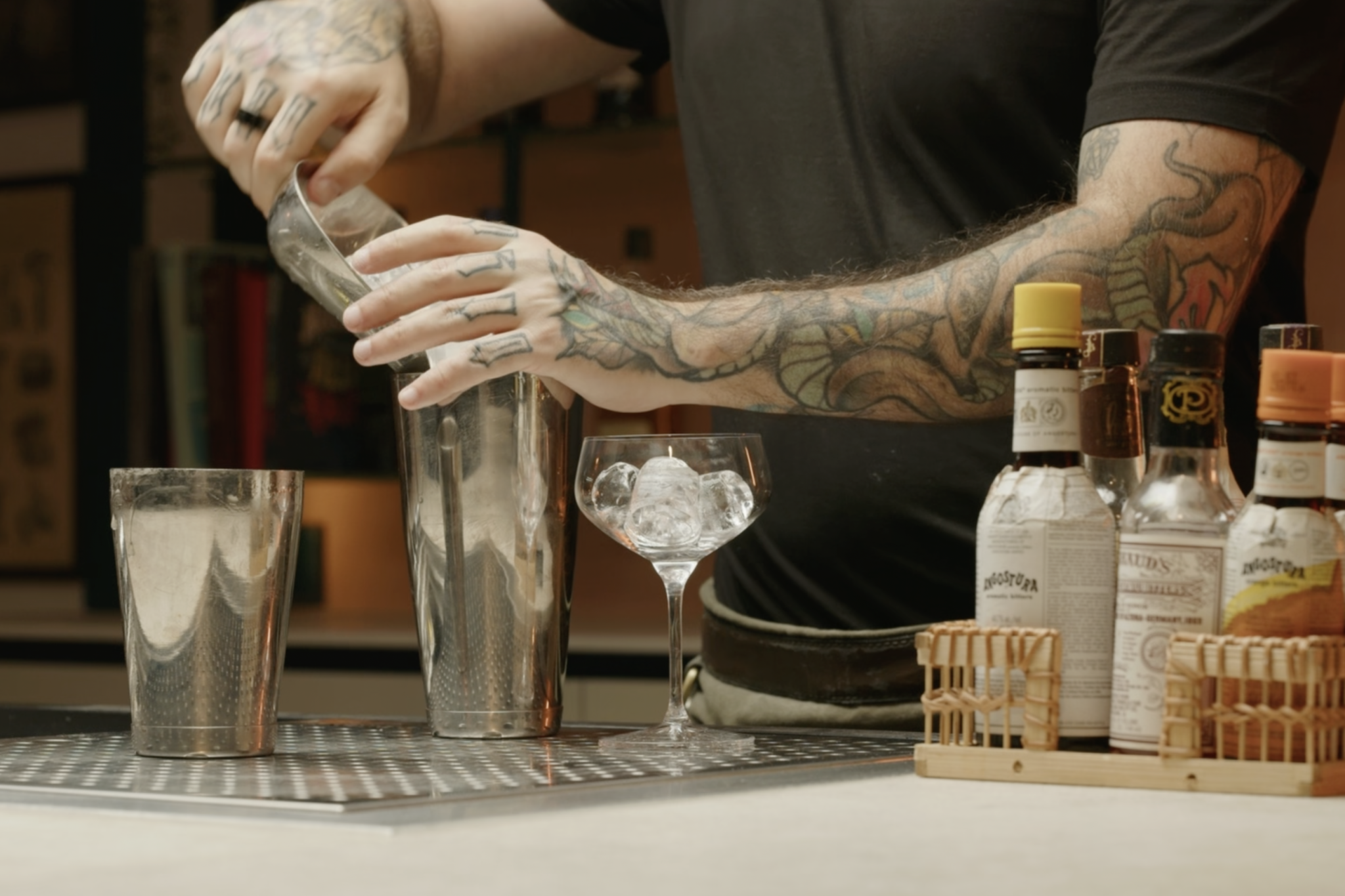 <p>Fill your cocktail shaker with ice cubes.</p>