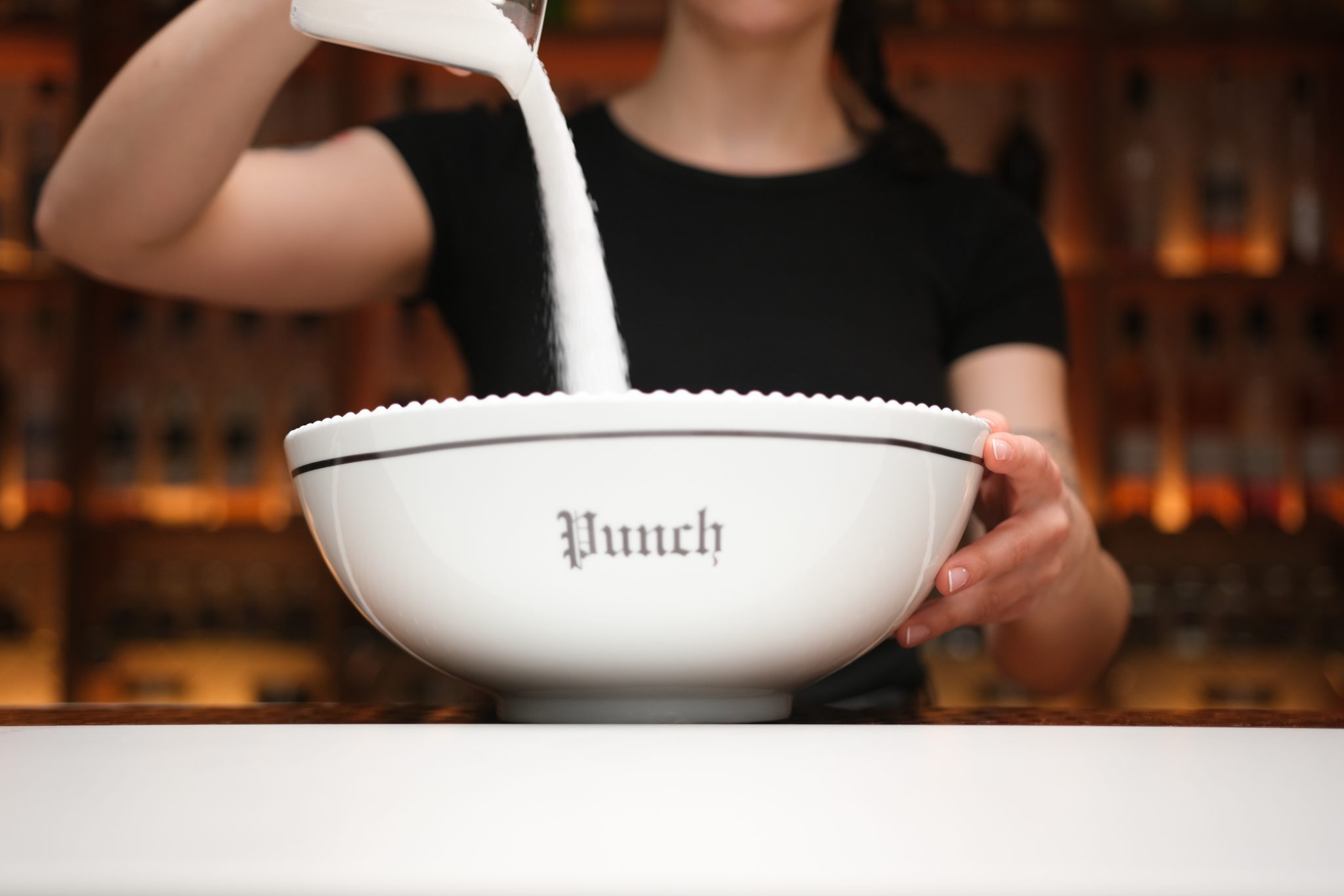 <p>Start by adding sugar to the punch or large mixing bowl.</p>
