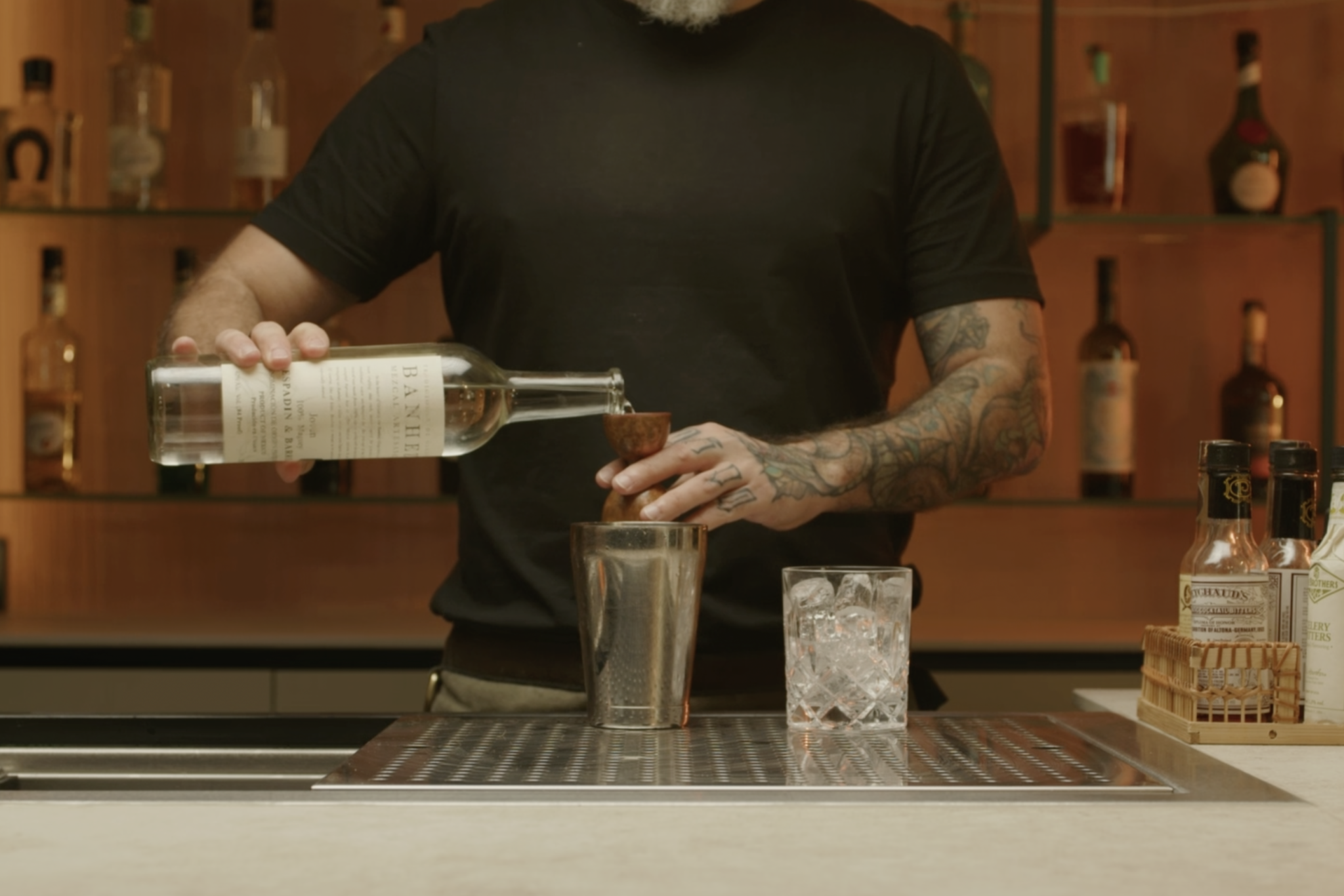 <p>Add 1 oz of mezcal to the shaker.</p>