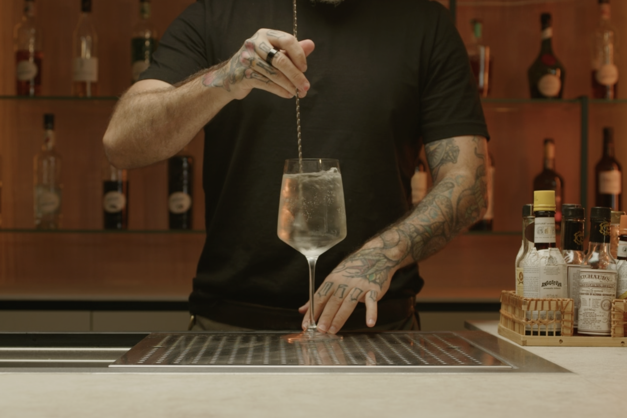 <p>Use a bar spoon to stir the ingredients gently, ensuring they mix well.</p>