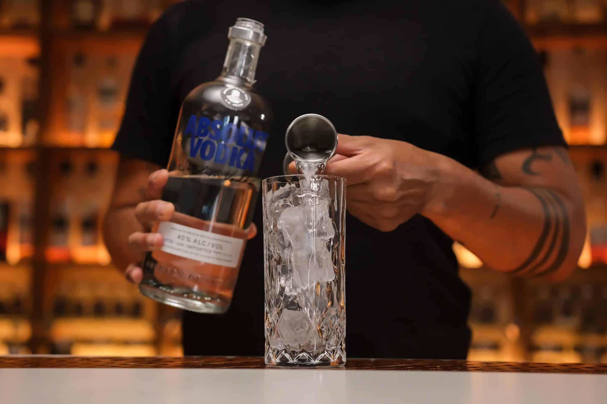 <p>Pour your chosen amount of vodka over the ice, laying the foundation for the cocktail’s strength.</p>
