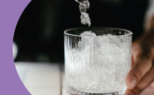 A shot of crushed ice added to an Old Fashioned glass