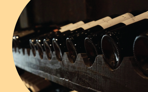 A shot of many fortified wine bottle stored on a wine shelf