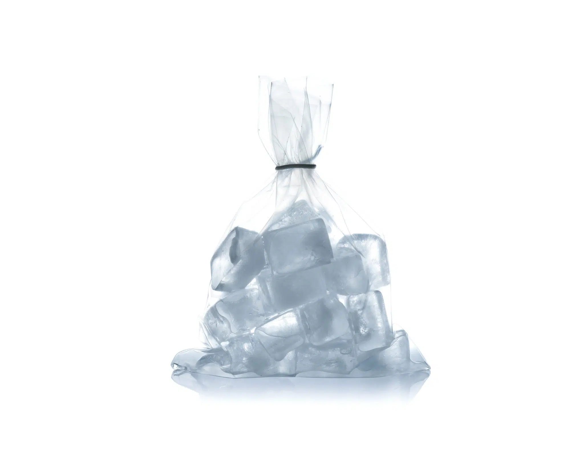 Transparent plastic bag with ice inside in front of a white background