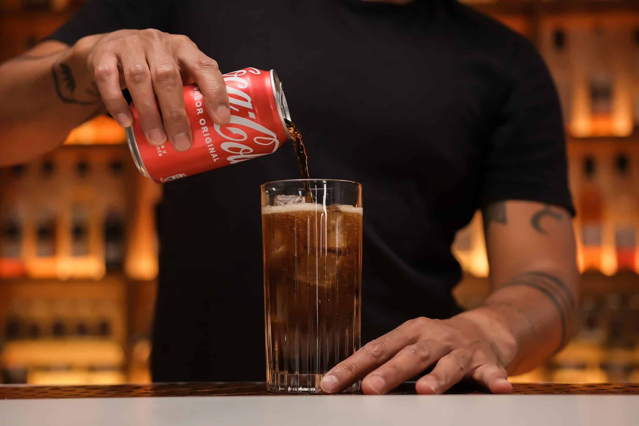 <p>Top off the glass with Coca-Cola, usually about 4 oz, adjusting to your taste preference.</p>
