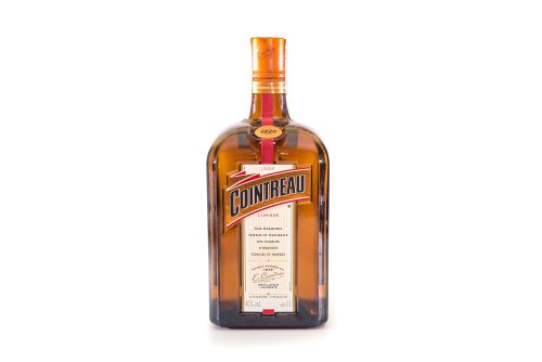 A shot of a 1 liter bottle of Cointreau in front of a white background