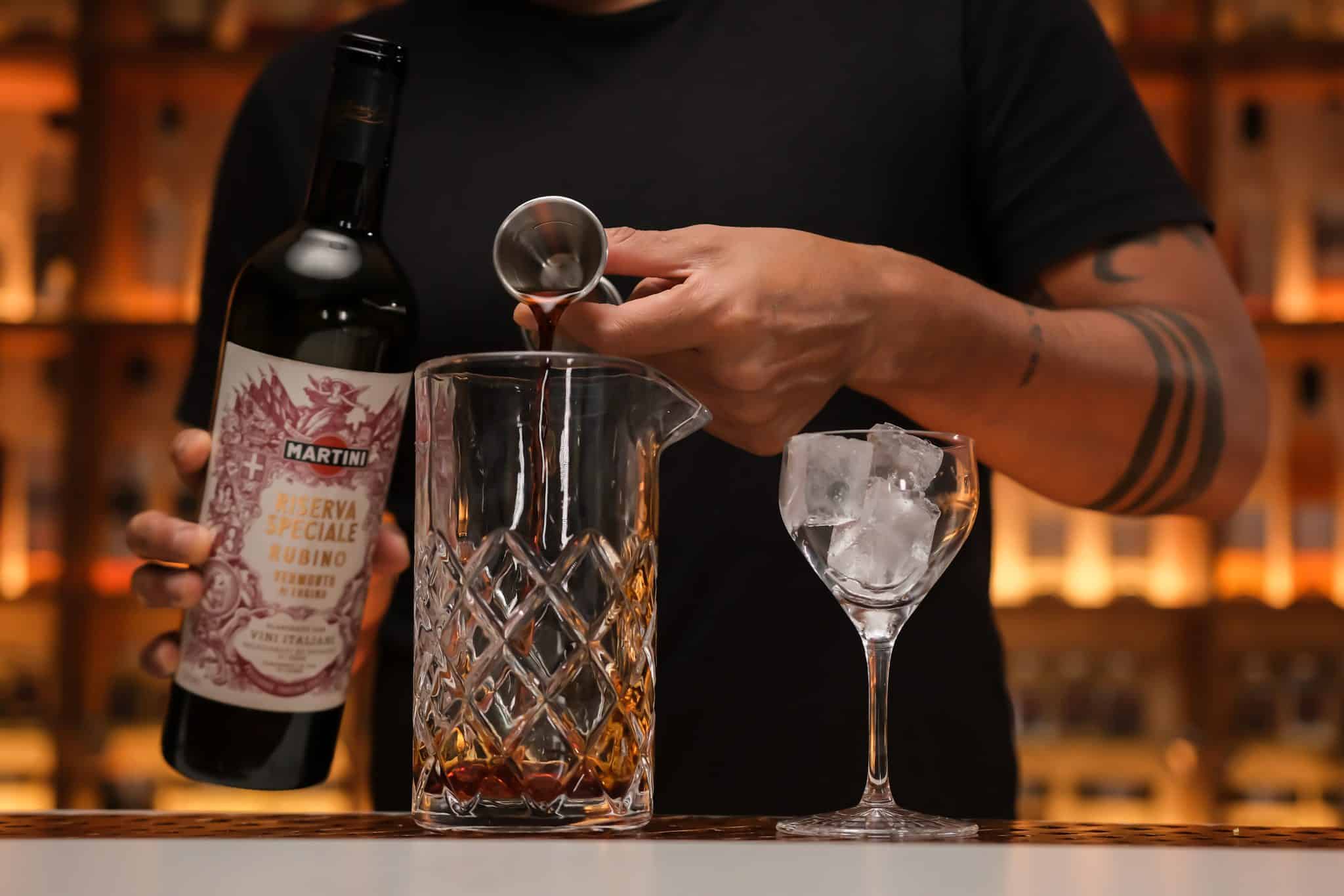 <p>Measure and add 1 ounce of sweet vermouth to complement and sweeten the rye whiskey.</p>
