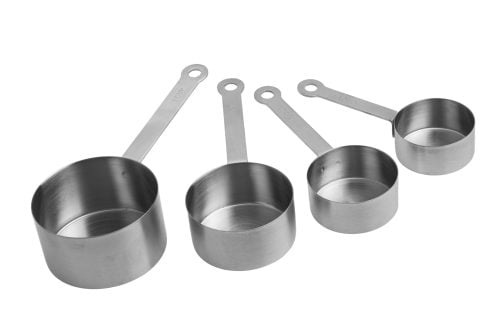 Four steel measuring cups on a white background