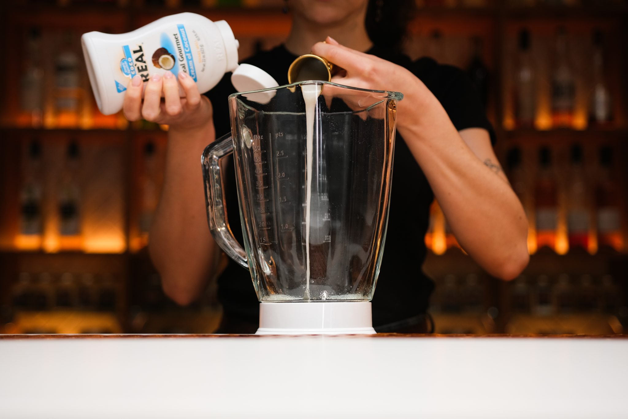 <p>Start by adding coconut cream into the blender glass.</p>
