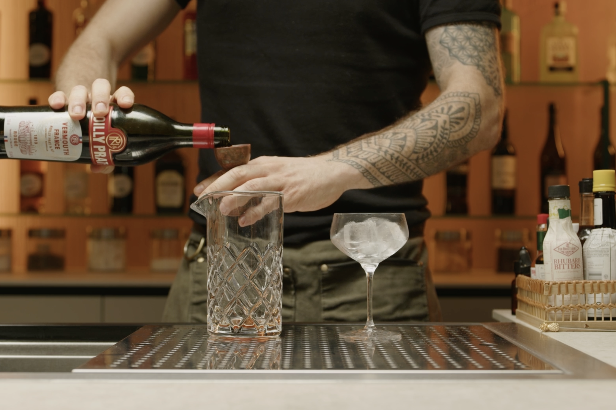 <p>Measure and pour 1 oz of sweet vermouth into the glass, adding sweetness and complexity.</p>