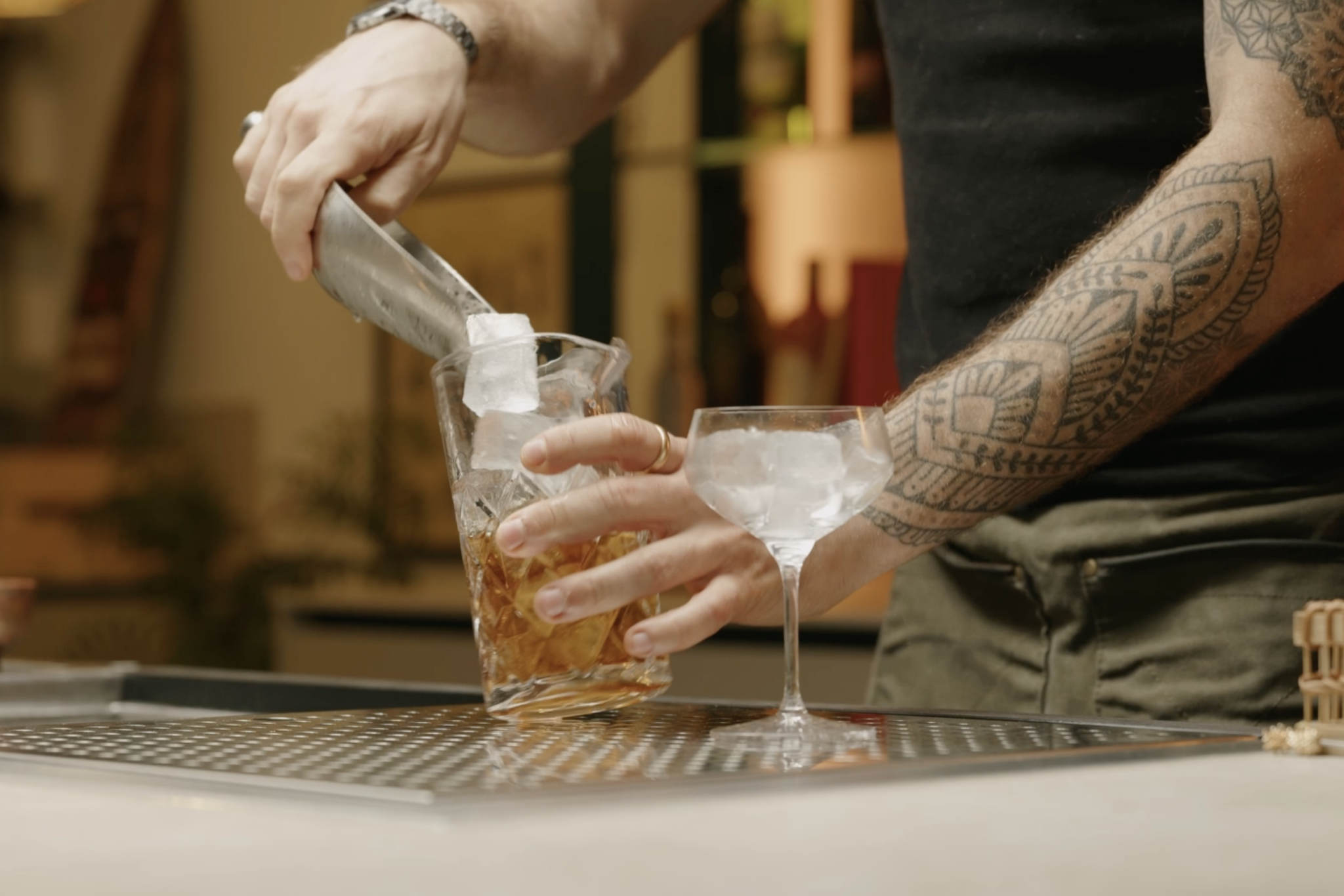 <p>Add more ice to the mixing glass if necessary.</p>