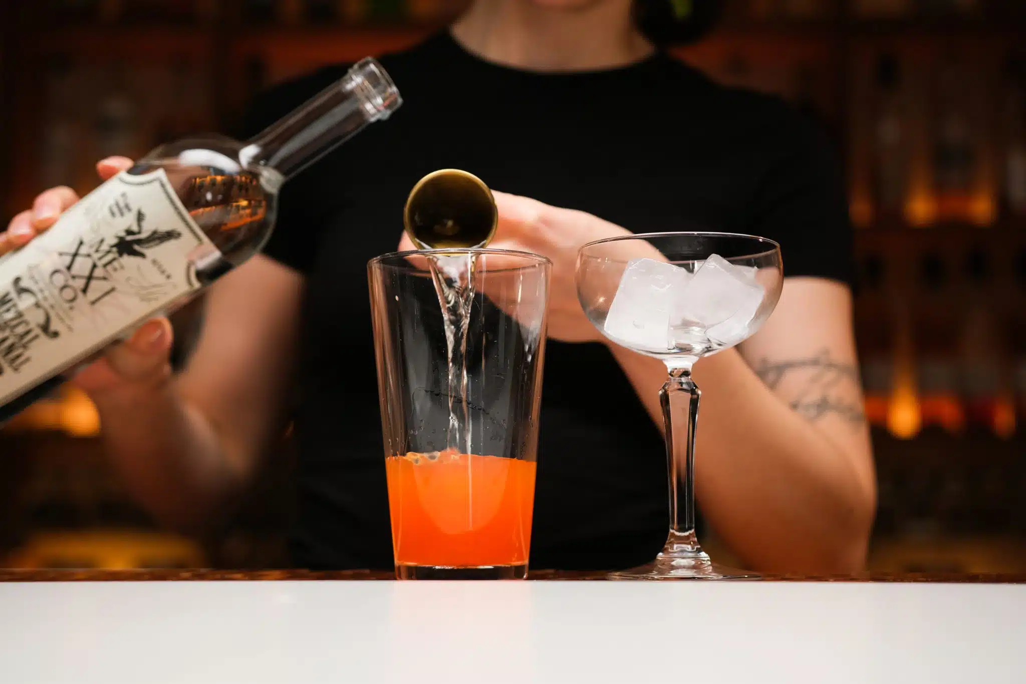 <p>Use your jigger to get the right amount of mezcal, ensuring the smoky base of your cocktail is precise.</p>
