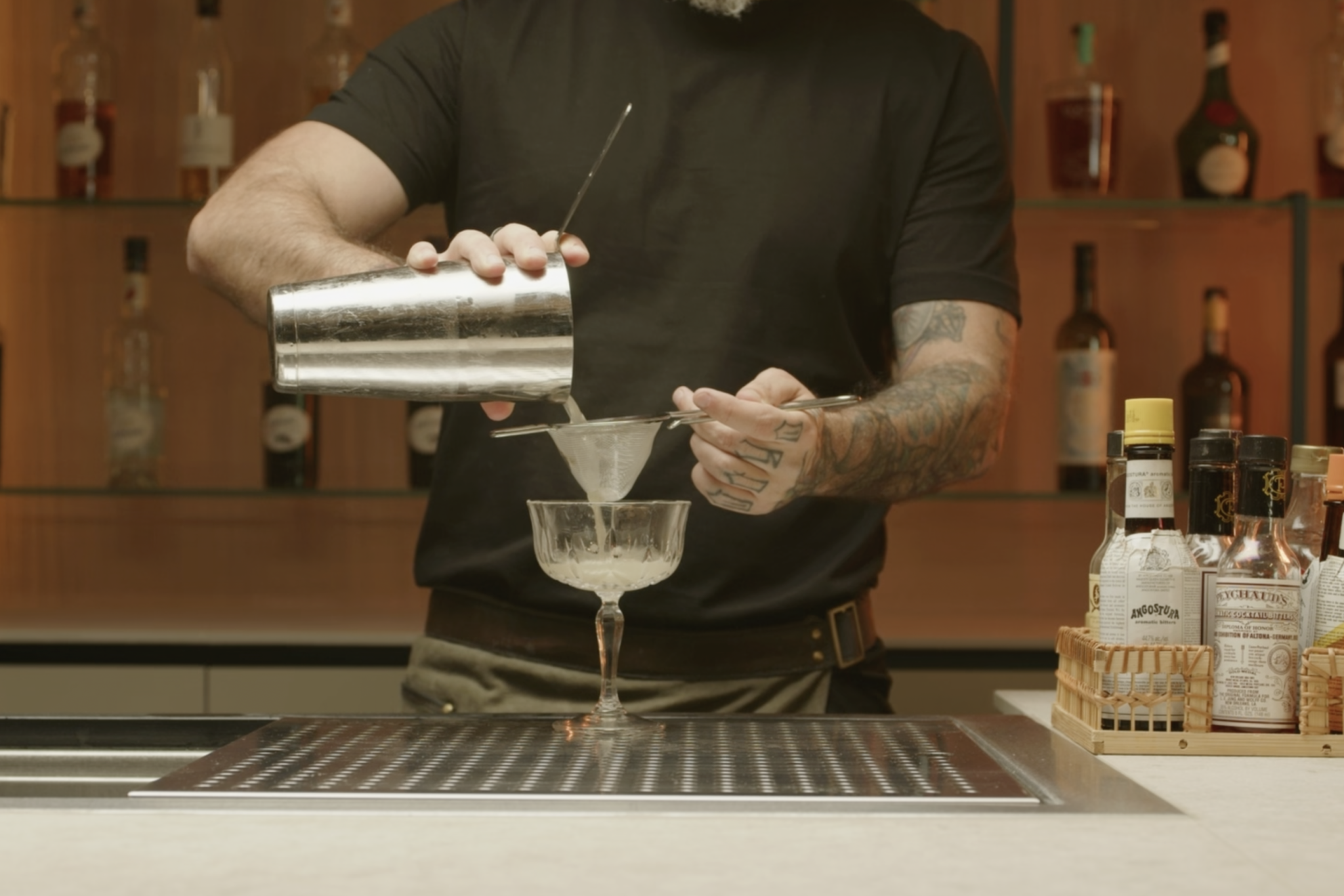 <p>Fine strain the mixture into the chilled coupe glass.</p>