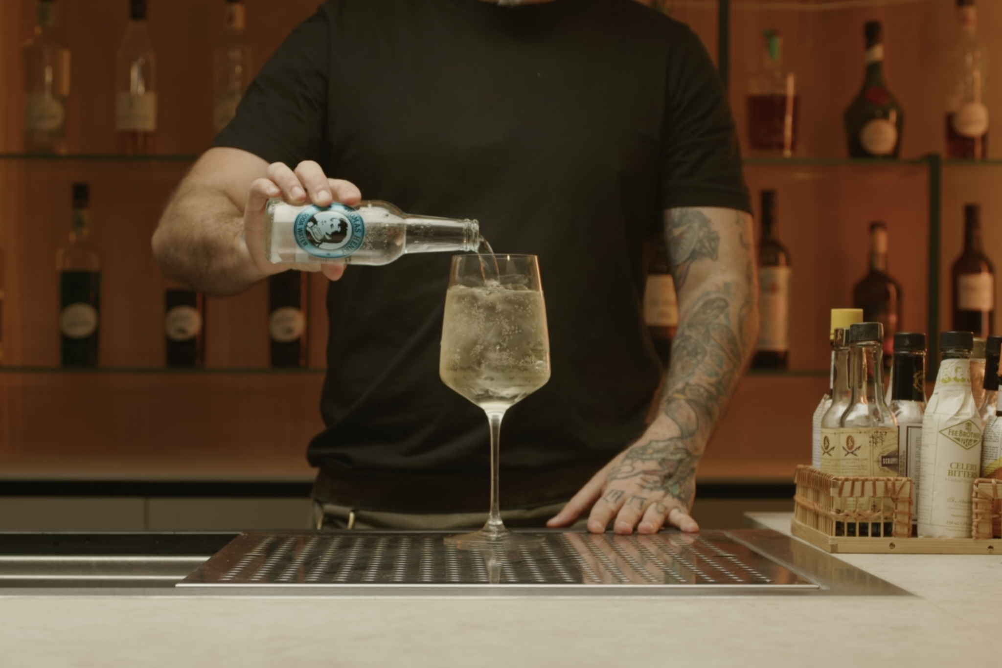 <p>Top up the glass with approximately 1 oz of soda water, adding effervescence to the drink.</p>