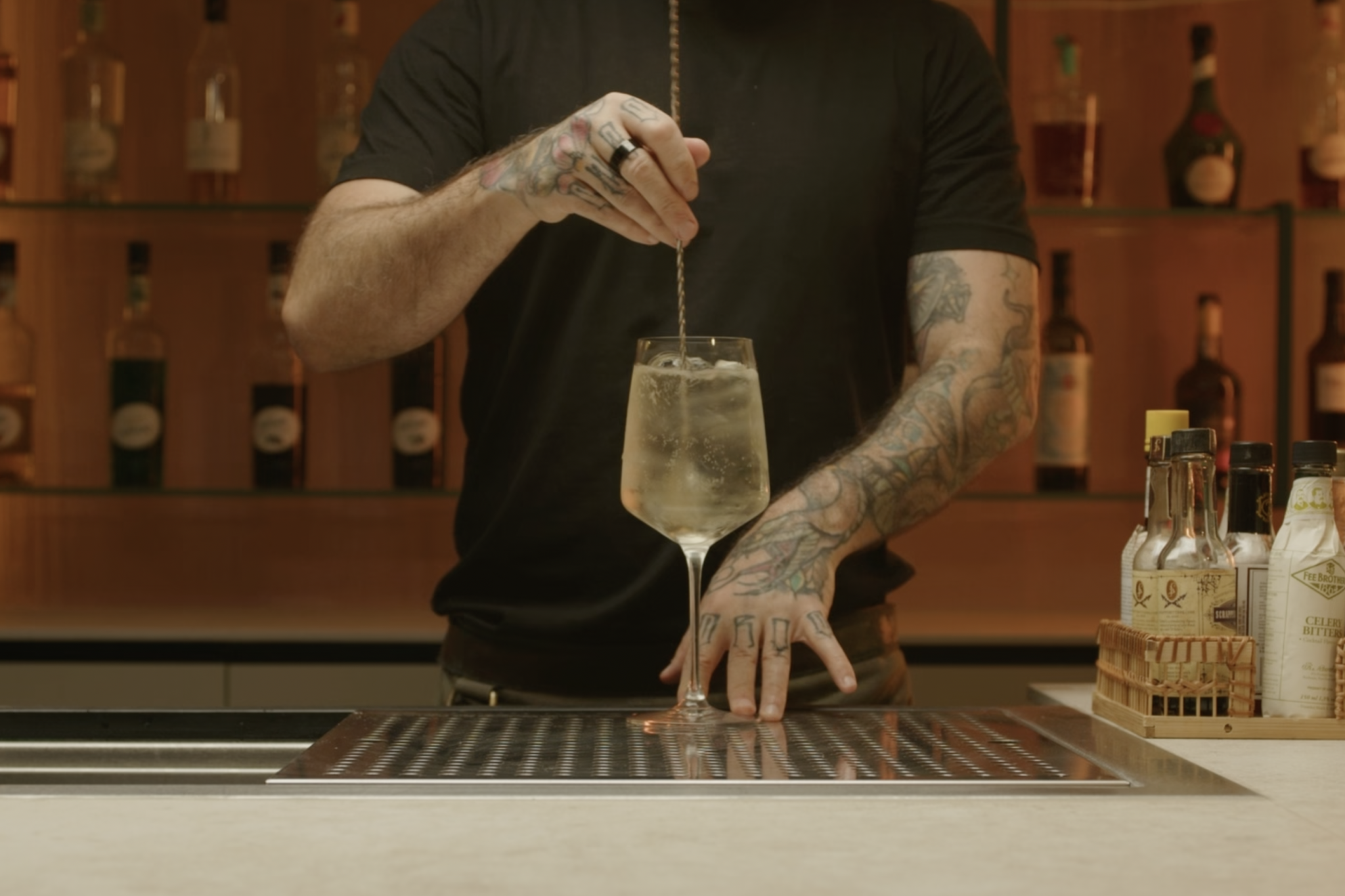 <p>Use a bar spoon to stir the ingredients gently, ensuring they combine well.</p>