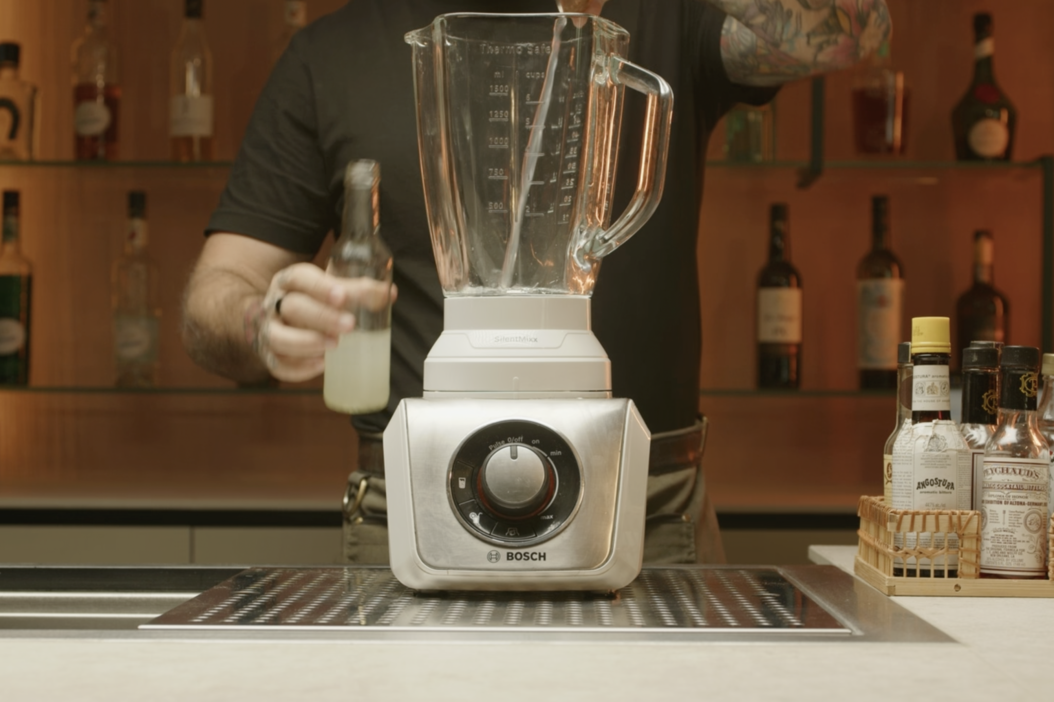 <p>Measure and pour ½ oz of lime juice into a blender.</p>