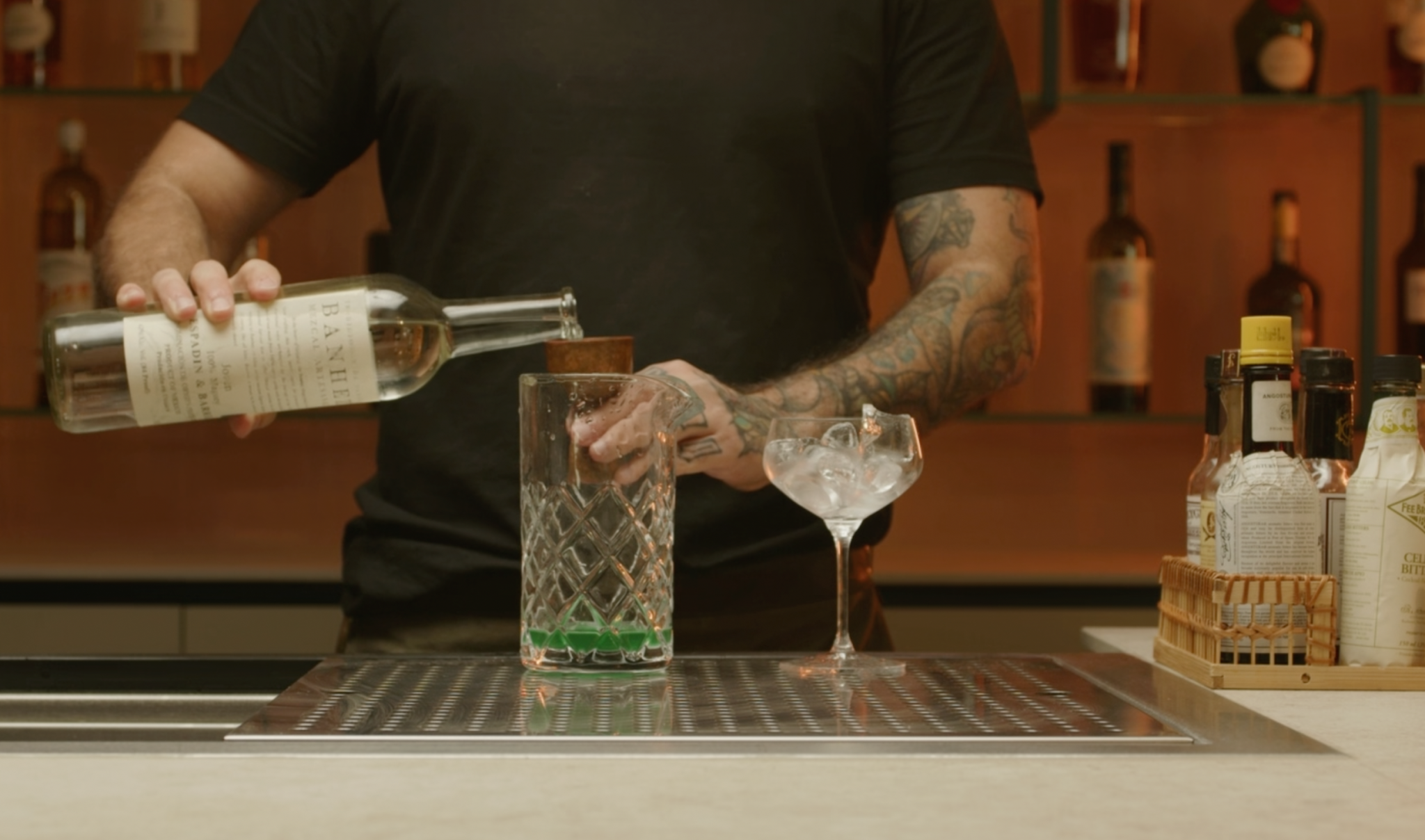 <p>Pour 1¼ oz of mezcal over the ice, adding a smoky, earthy base to the cocktail.</p>