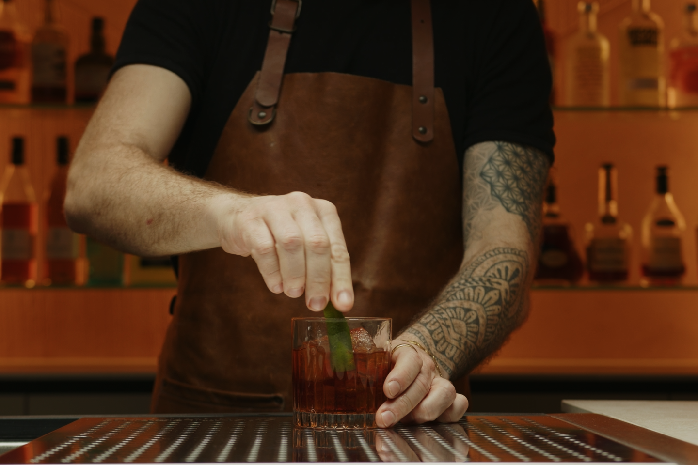 <p>You can then place the zest on the rim of the glass or drop it directly inside the glass.</p>
