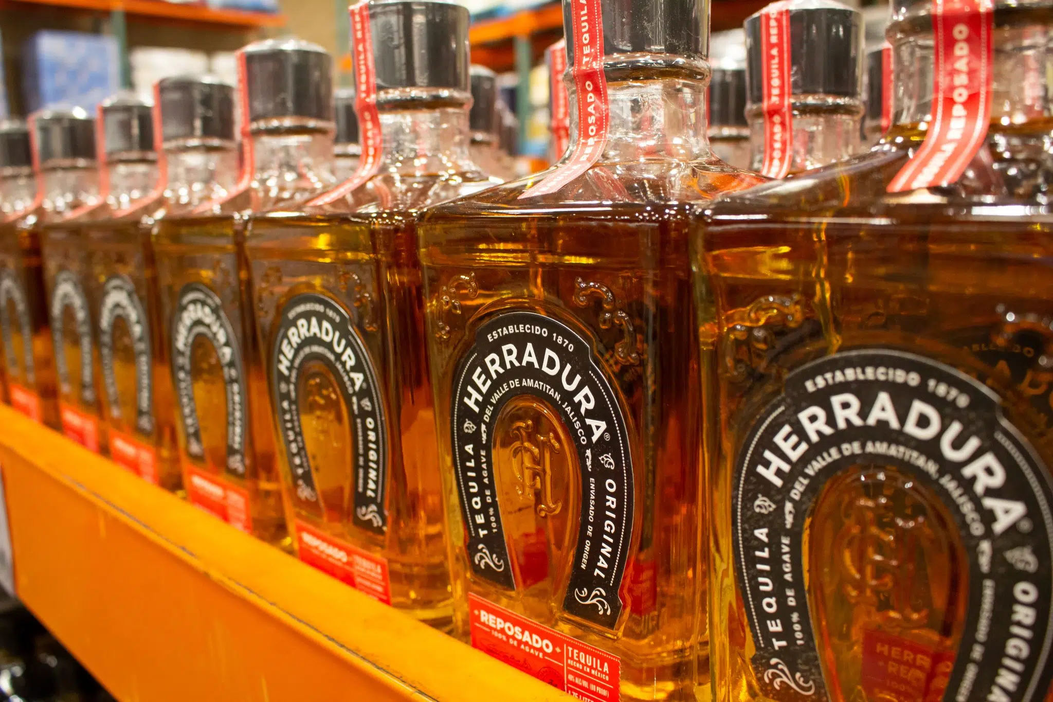 Six bottles of Reposado Tequila Herradura exhibited in a store