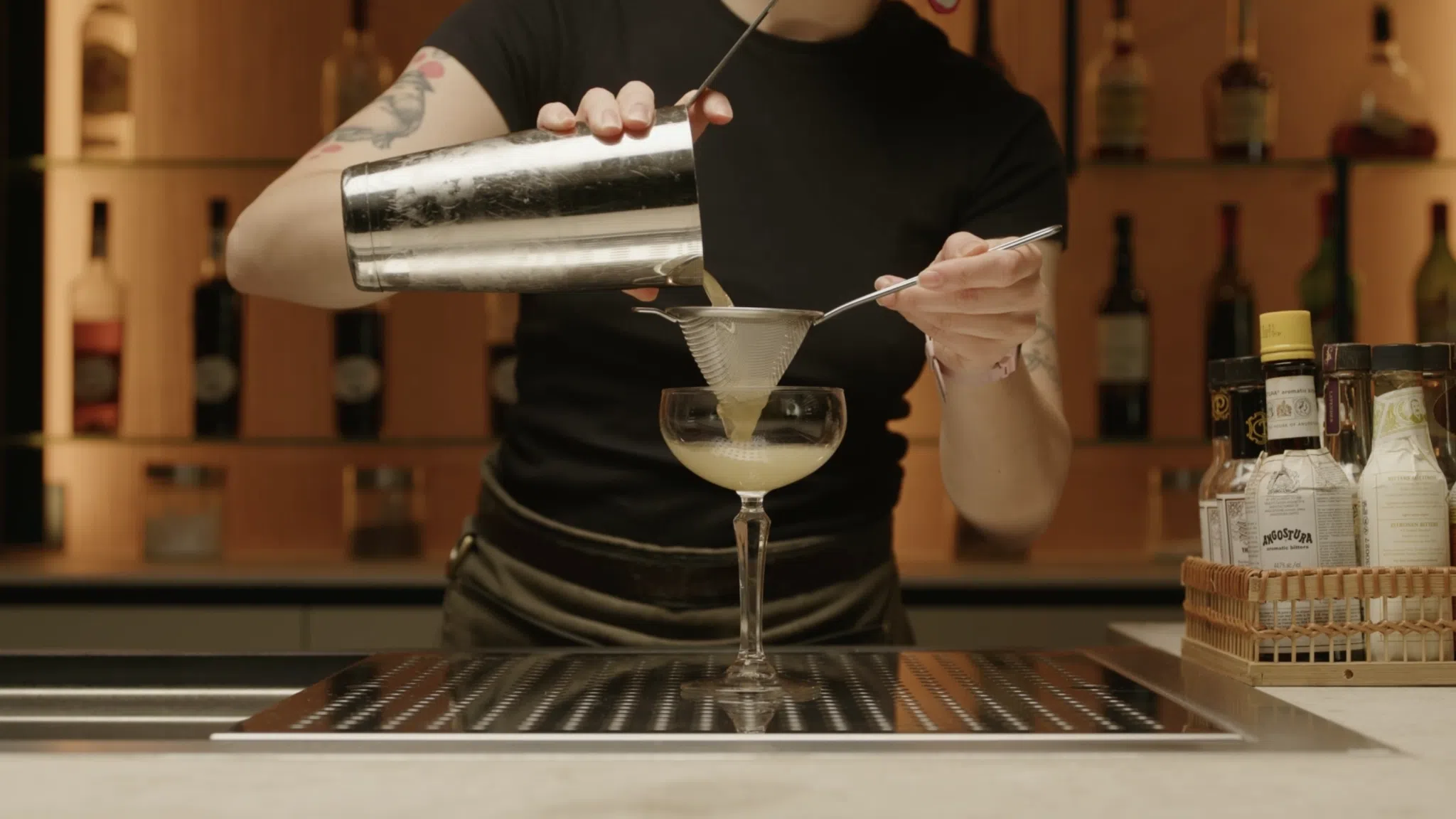 <p>Fine strain the cocktail into a coupe glass, ensuring a smooth pour.</p>
