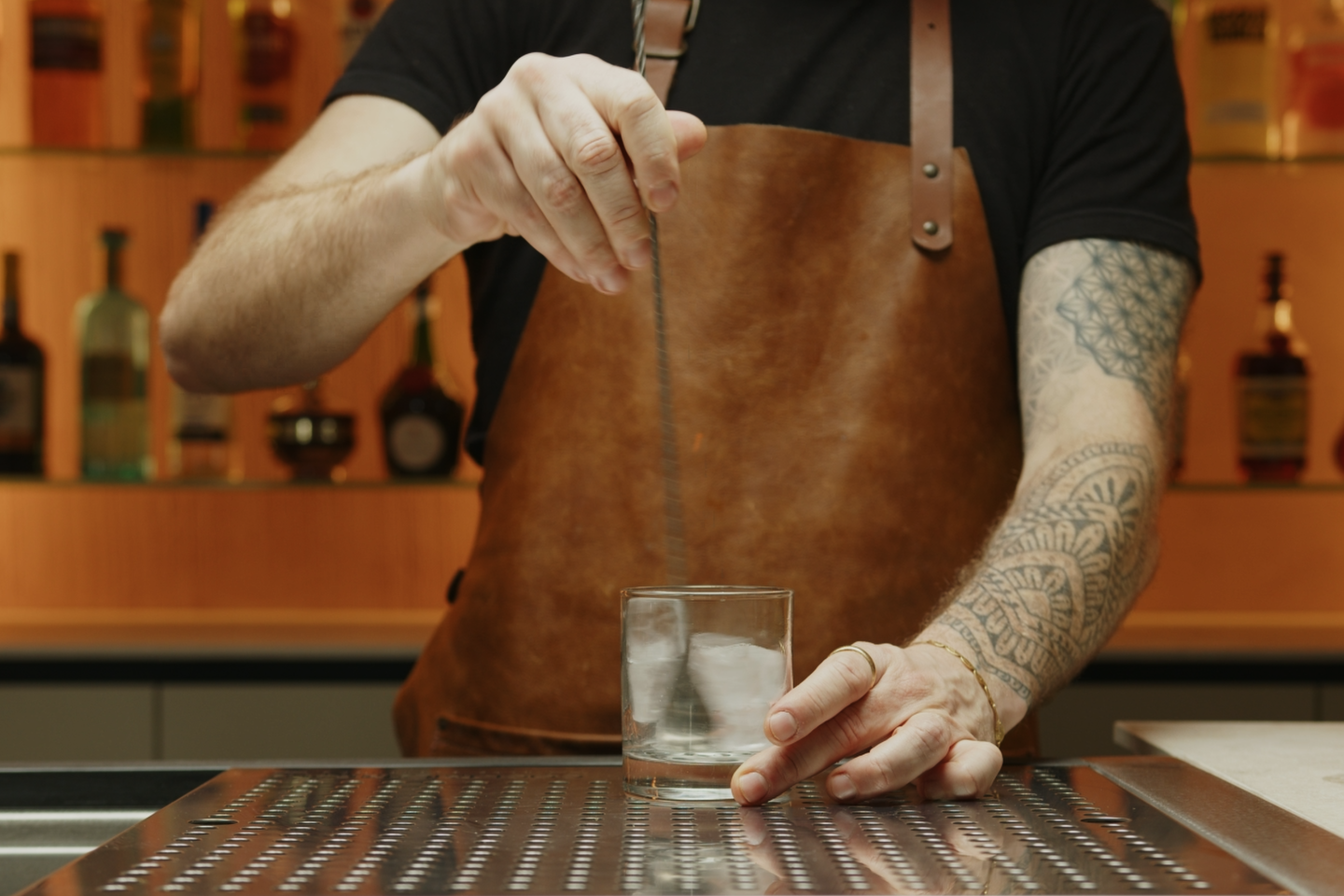 <p>Then, stir the ice cubes in the old fashioned glass with a bar spoon. This will ensure that your cocktail is served at the perfect temperature.</p>
