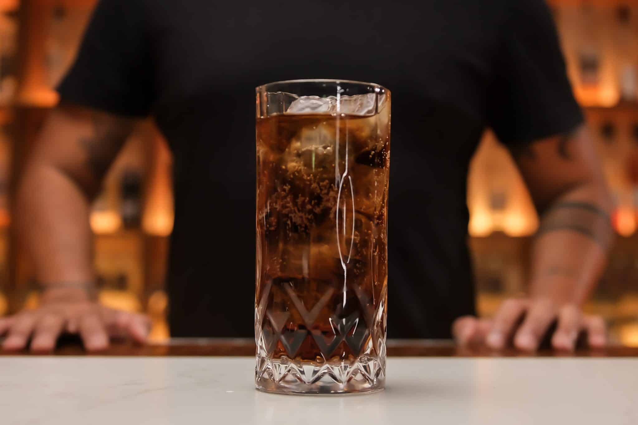 <p>Optionally, squeeze a lime wedge over the top and drop it into the glass for a citrusy touch.<br />
Enjoy your Rum and Coke!</p>
