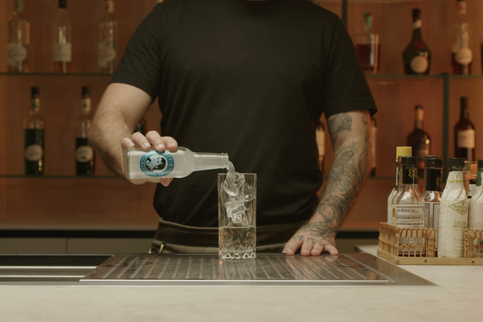 <p>Measure and pour 4 oz of soda water into the glass, adding bubbles and lightness.</p>