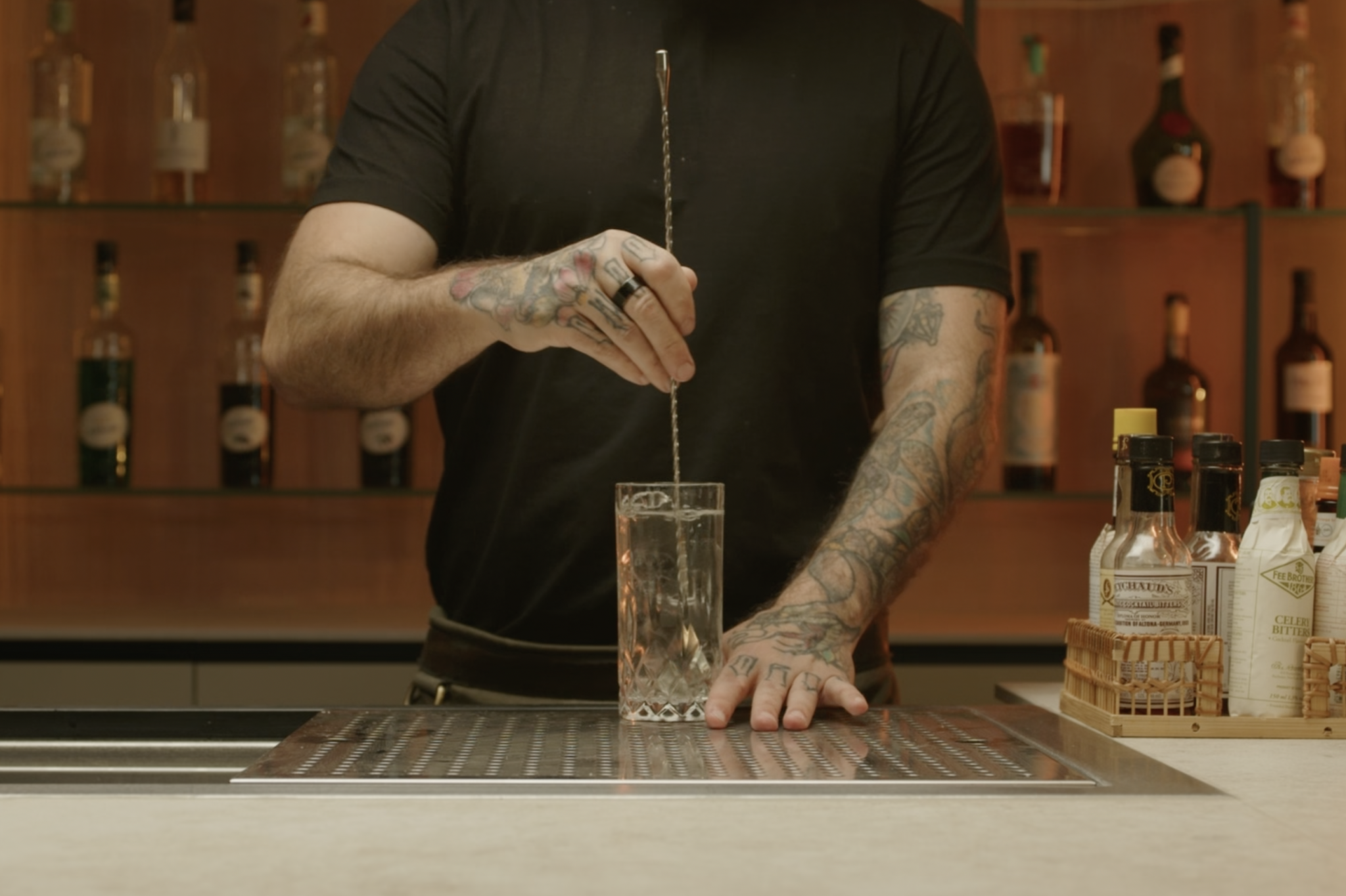 <p>Use a bar spoon to stir the ingredients gently, ensuring they combine well.</p>