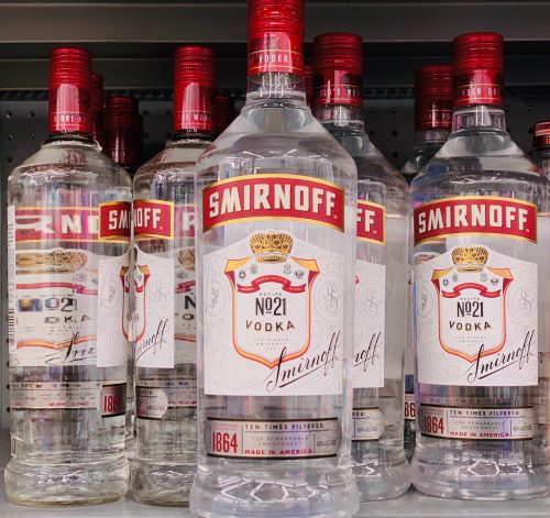 A side shot of six bottles of nine liter Smirnoff vodka