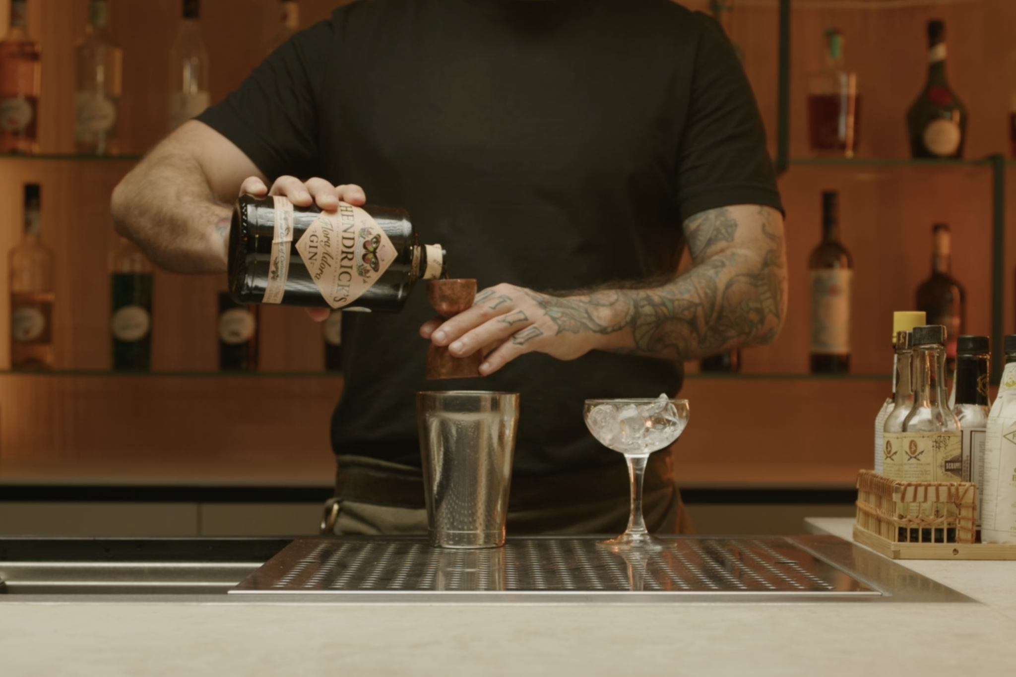 <p>Measure and pour 1 oz of gin into the shaker.</p>