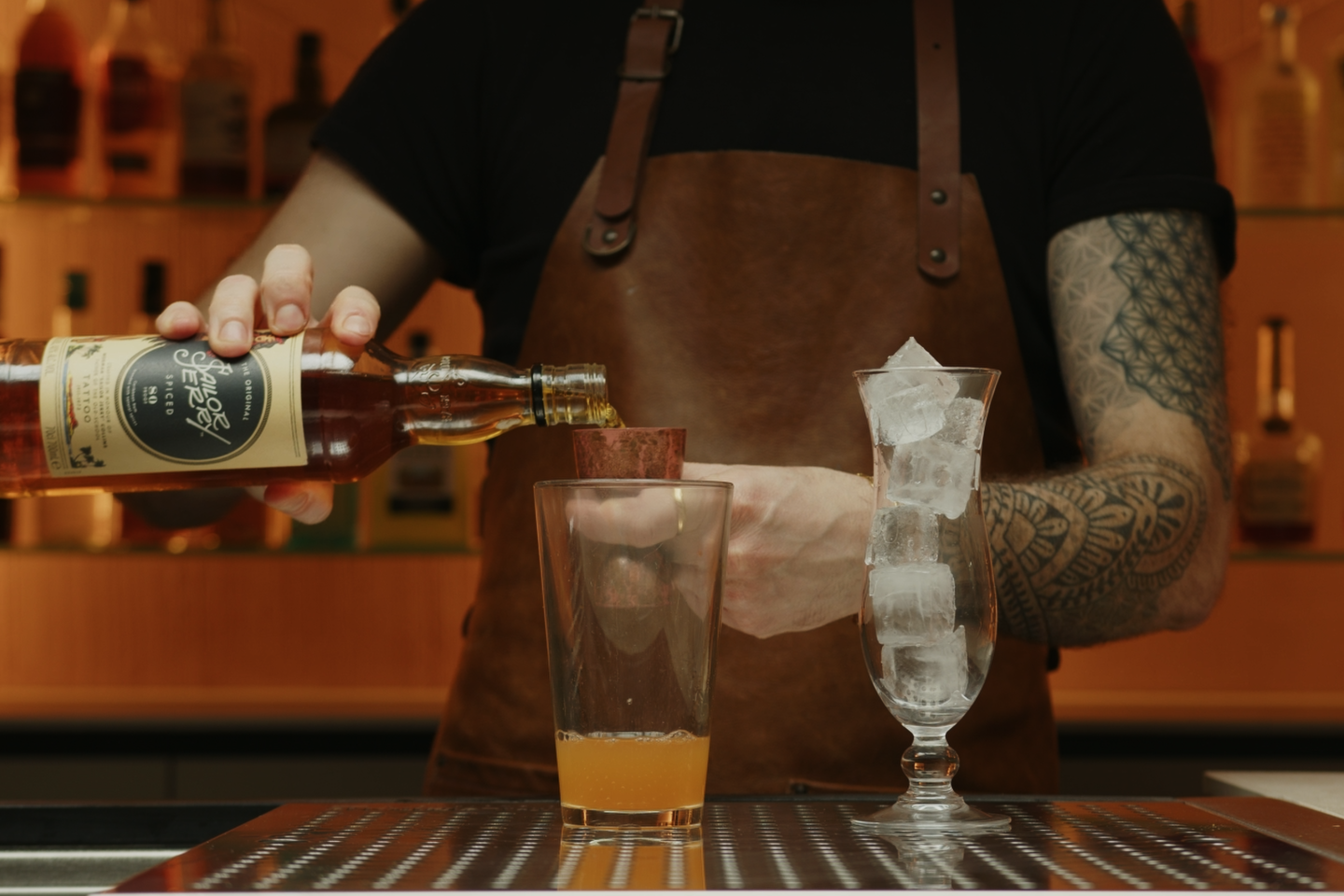 <p>Finally, add 2 ounces of spiced rum to the mix. The spiced rum is the star of the cocktail, bringing a rich, warm, and slightly spicy character that forms the backbone of the drink.</p>
