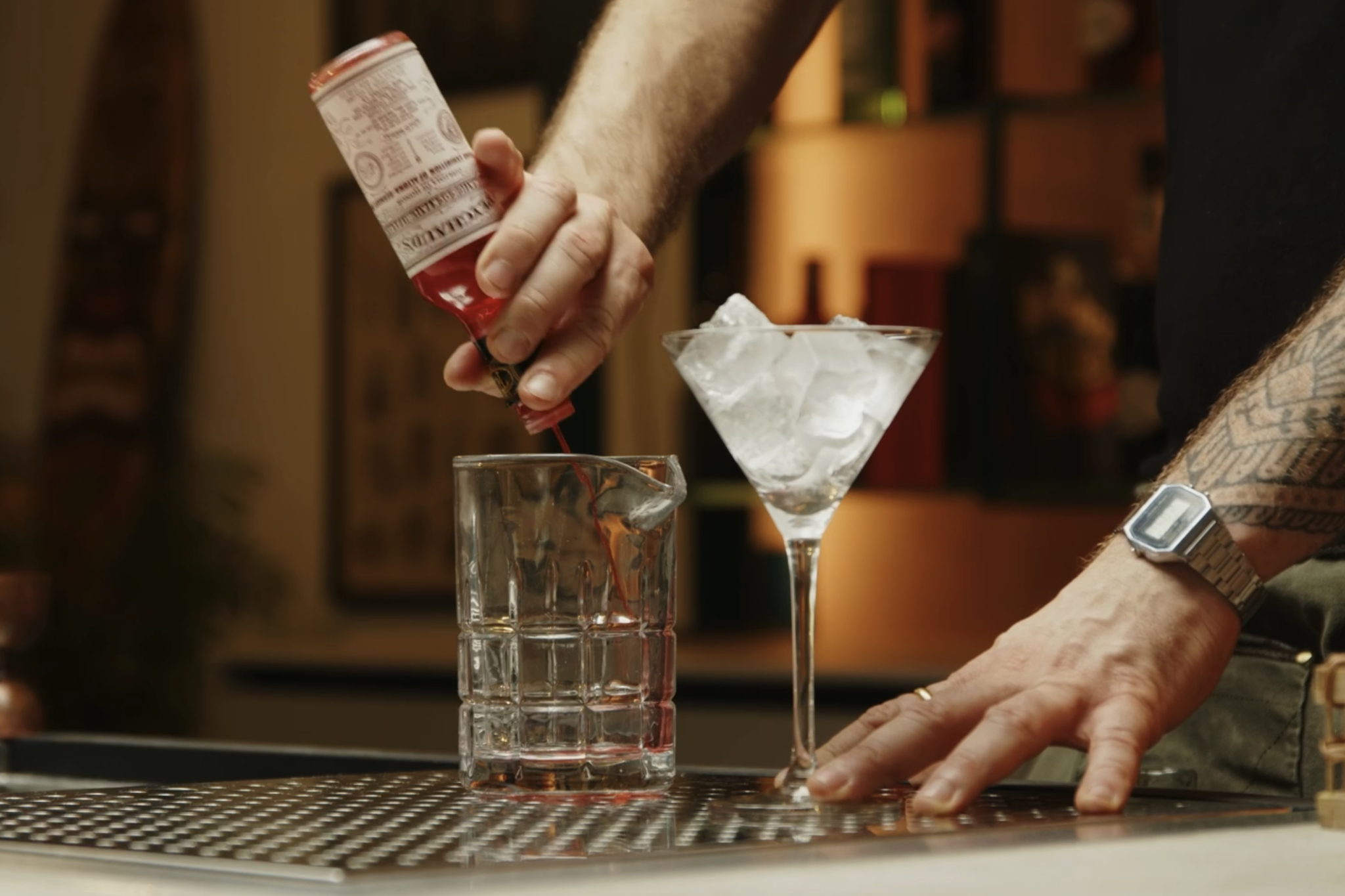 <p>In a mixing glass, begin by pouring 3 dashes of Peychaud's bitters, which will bring a subtle hint of spice and complexity to the cocktail.</p>
