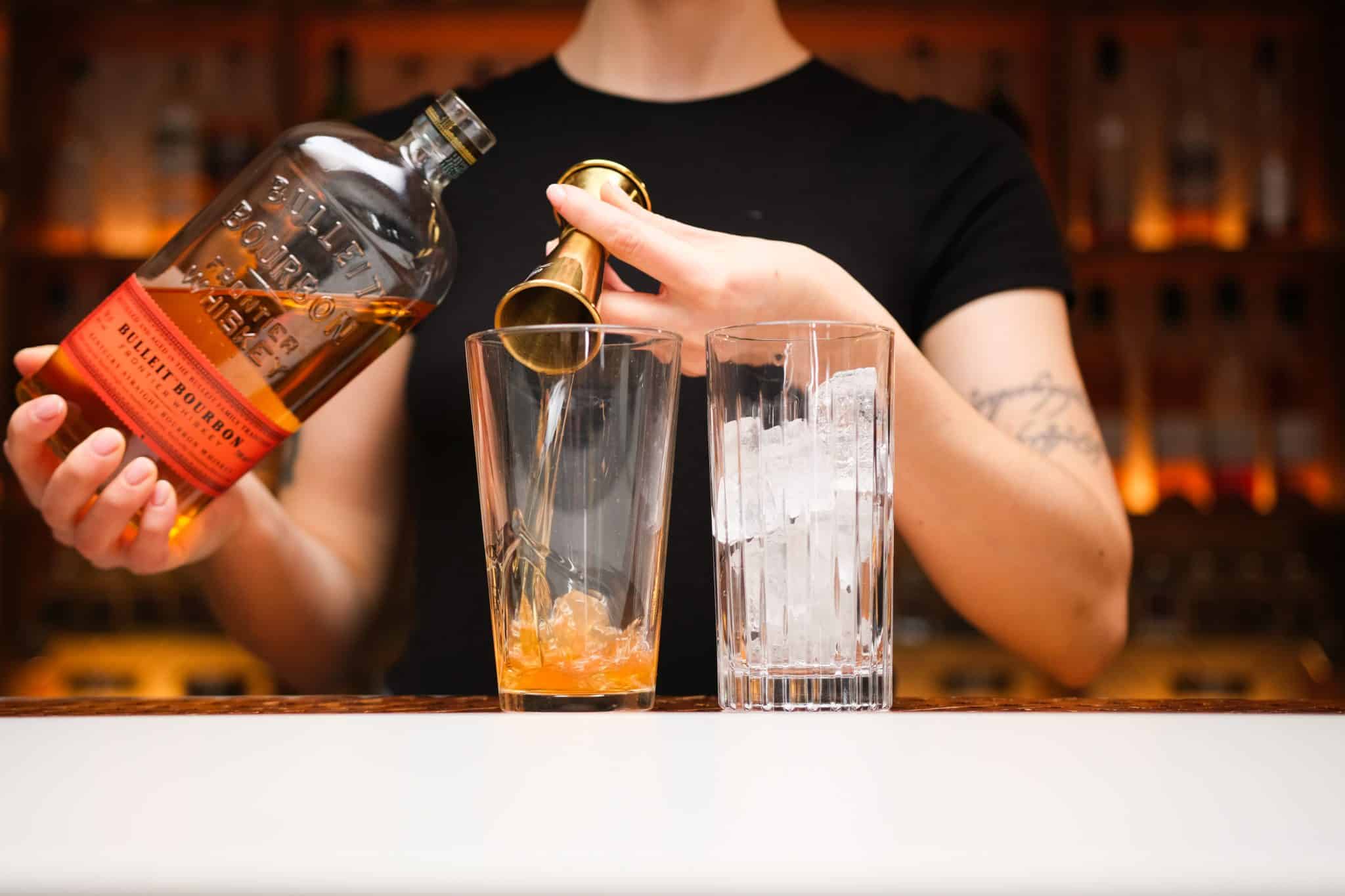 <p>Pour 1 oz of bourbon into your shaker, setting the base for the cocktail’s robust flavor.</p>
